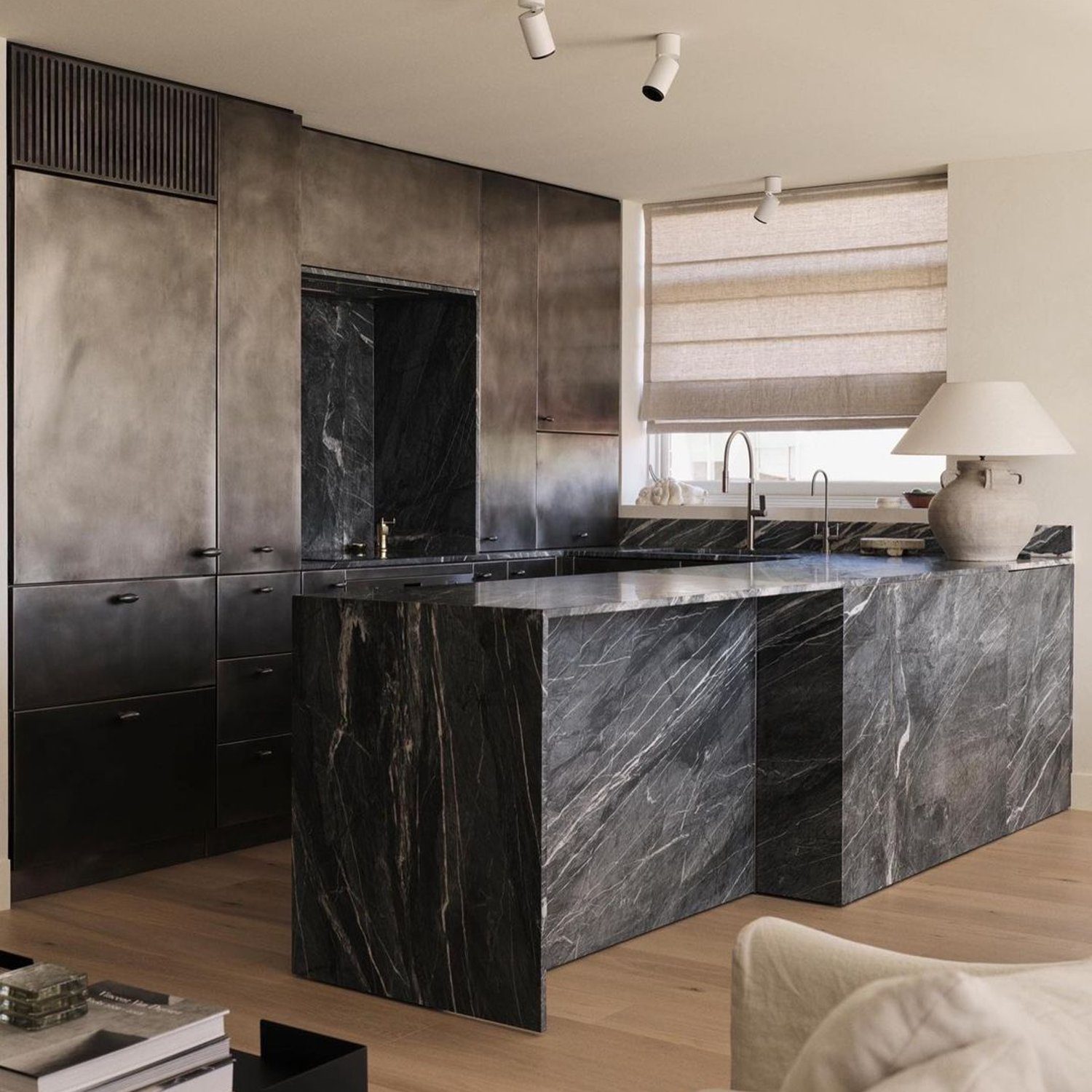 An elegant kitchen featuring marble accents