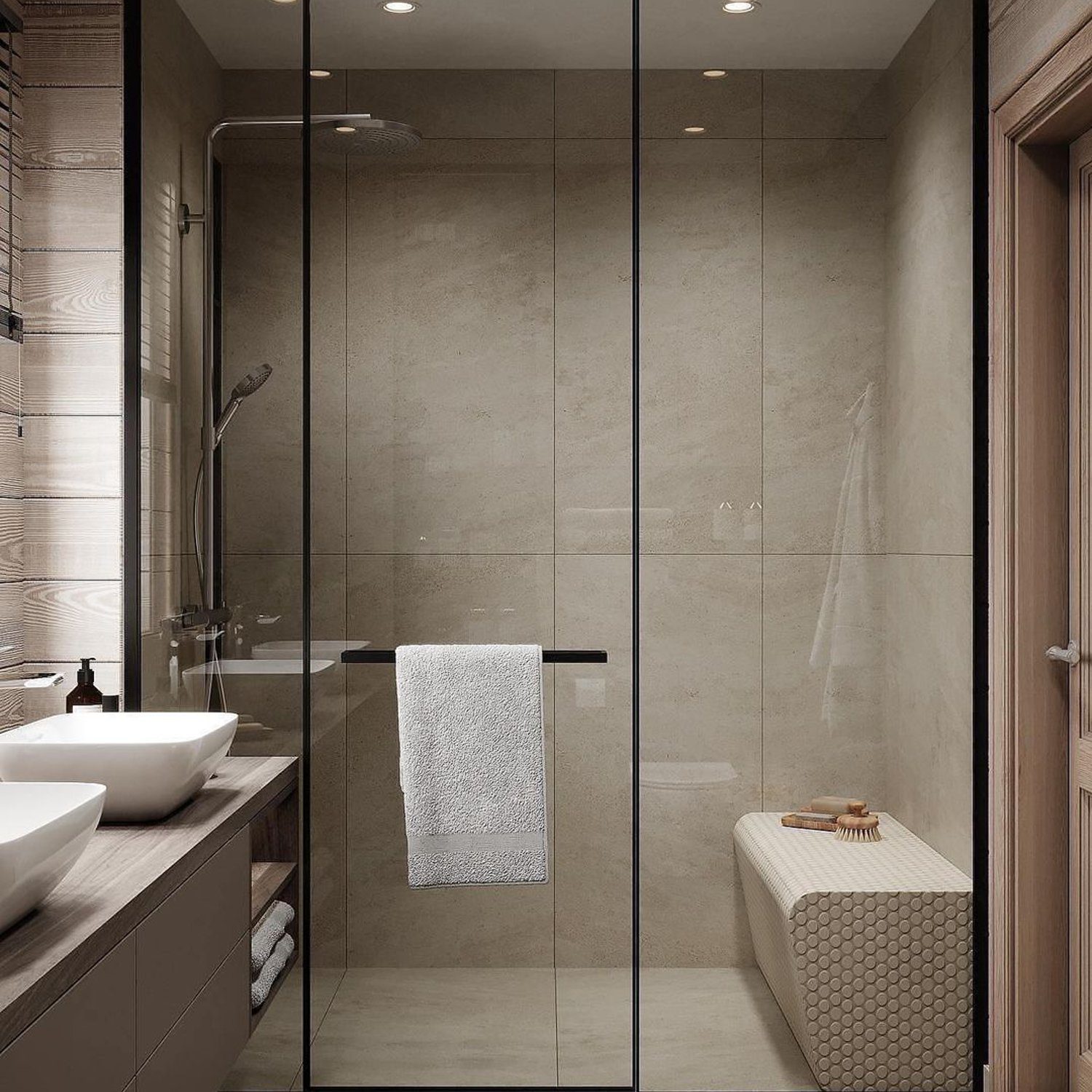 A modern minimalist bathroom with a glass shower enclosure