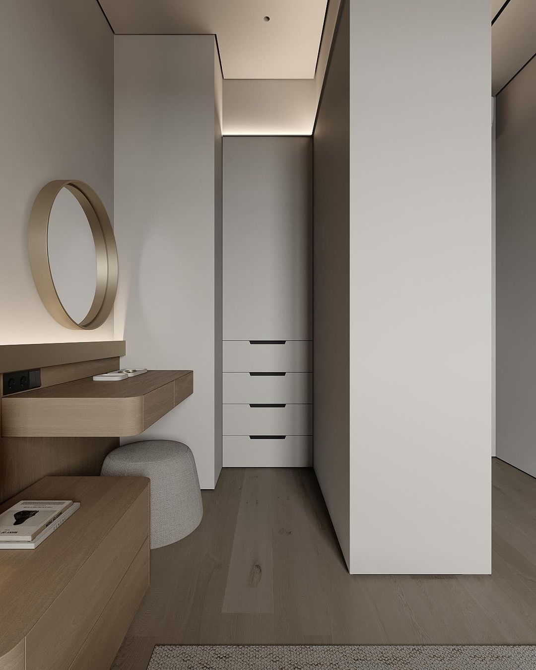 A modern minimalist bathroom with a wooden floating vanity and circular mirror