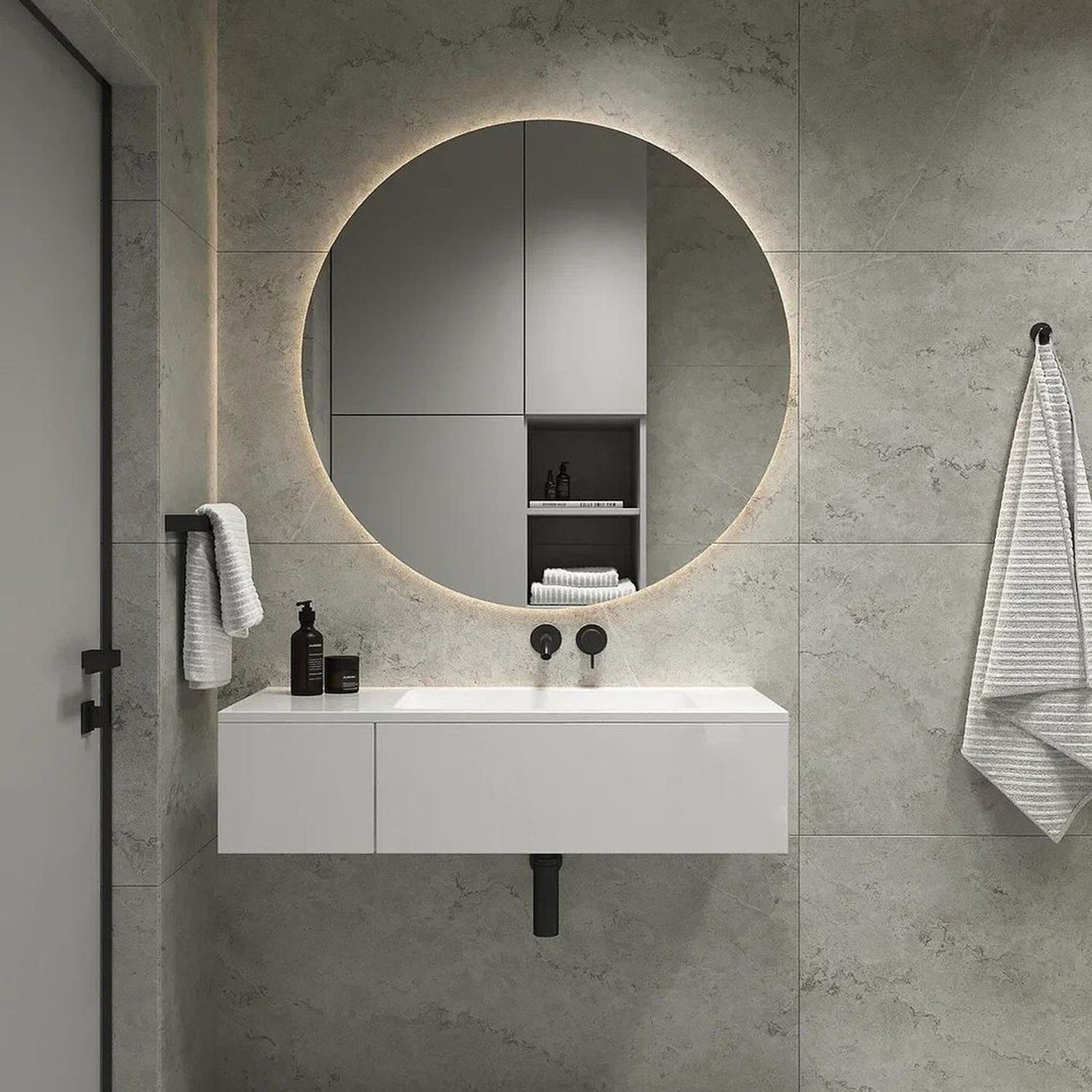 A modern minimalist bathroom with seamless grey tiles