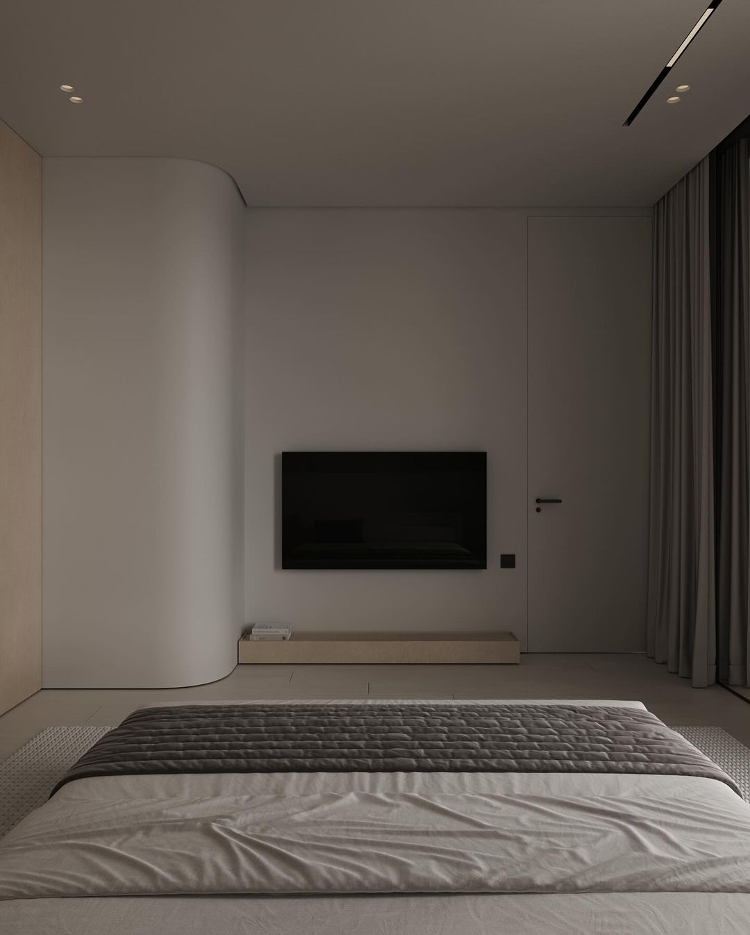 A modern minimalist bedroom featuring clean lines and subdued colors