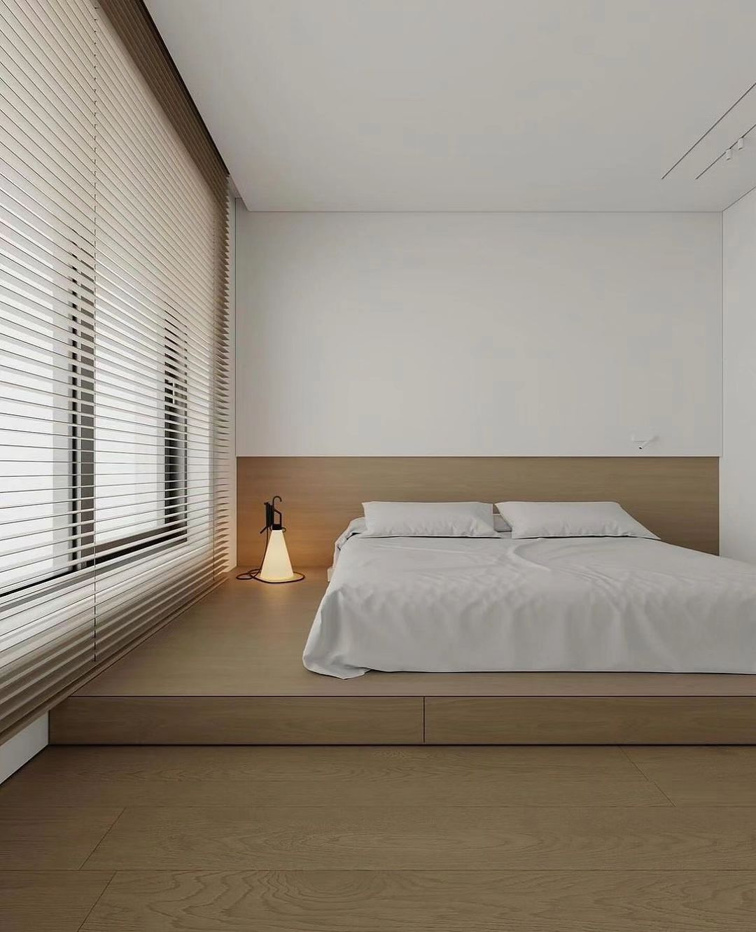 Modern minimalist bedroom design with natural wood flooring