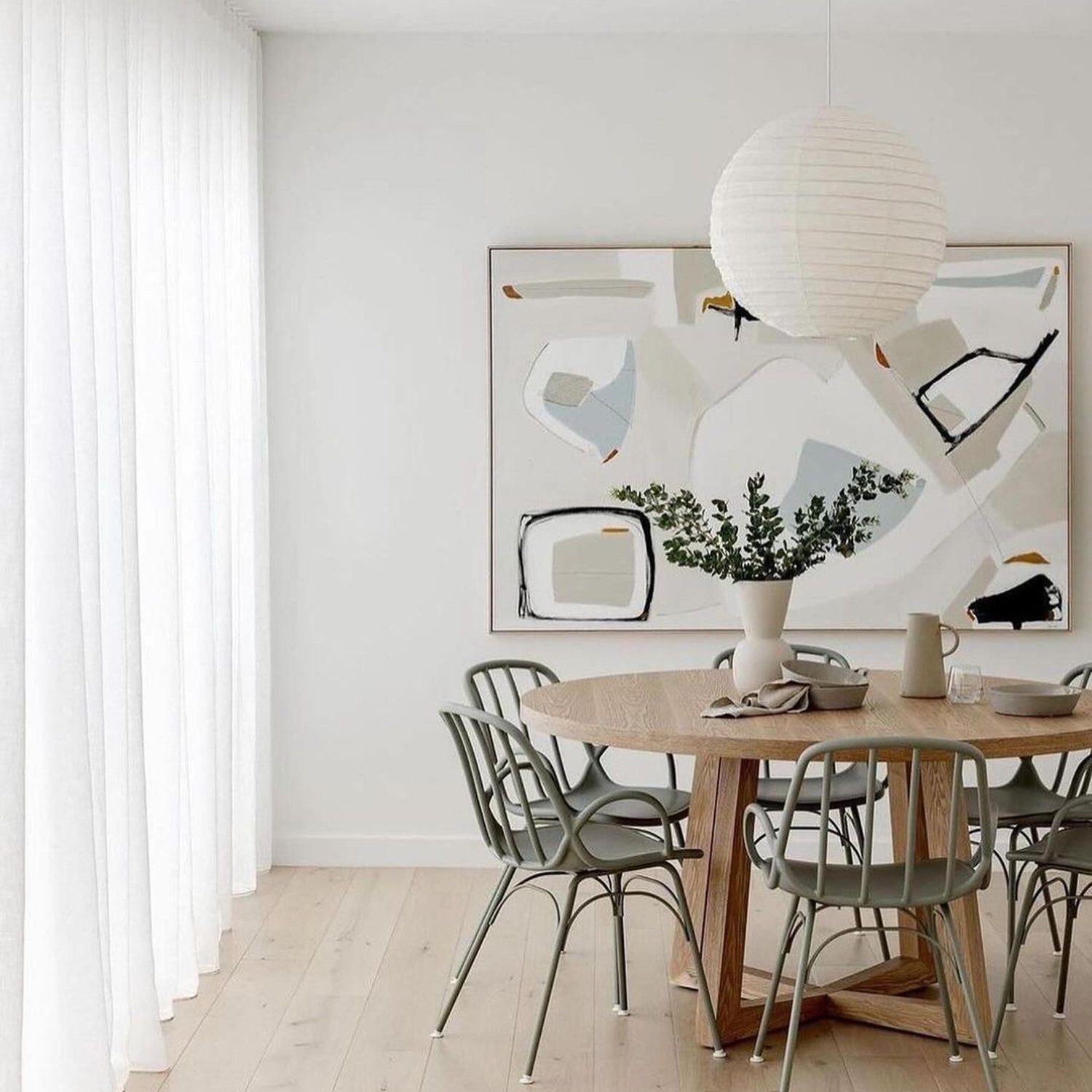 A minimalist dining space with artistic flair