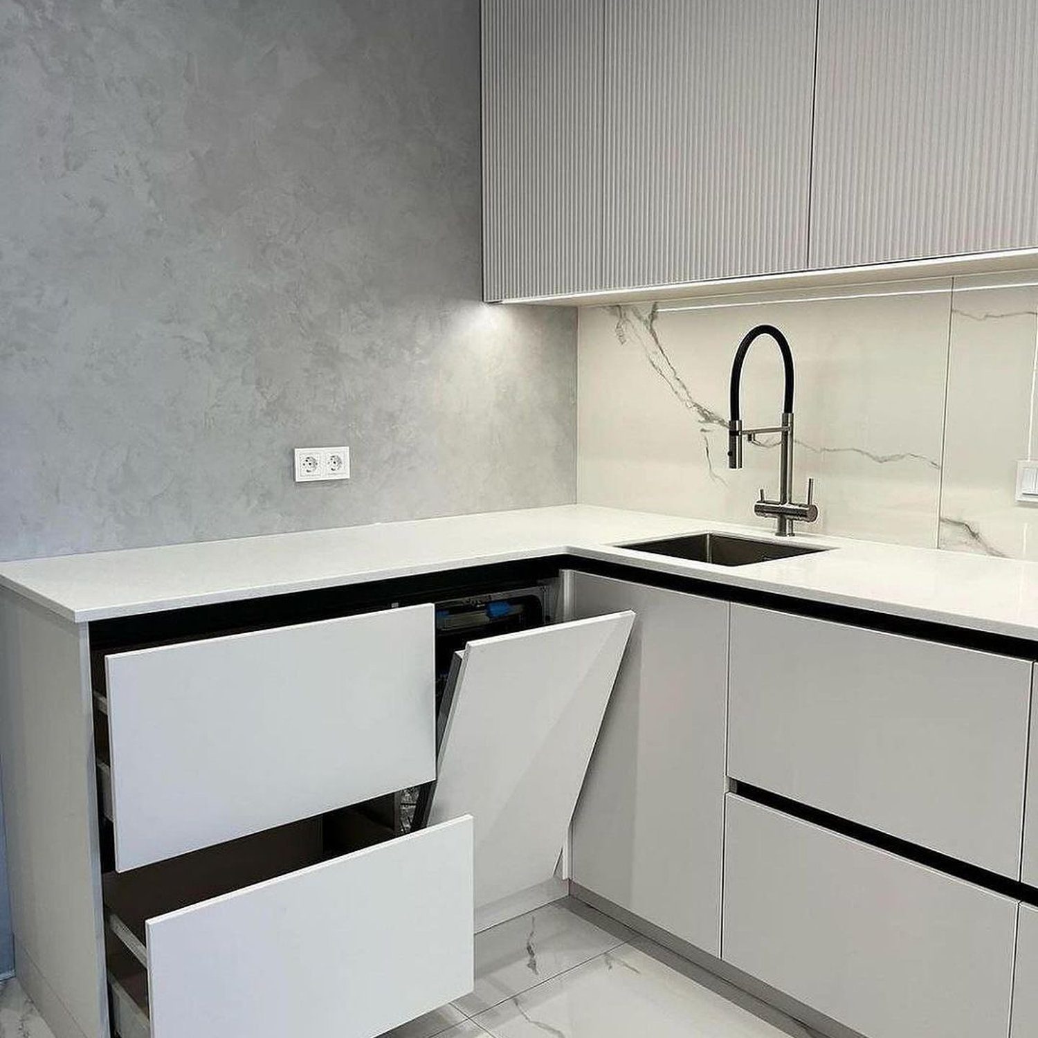 Modern minimalist kitchen with innovative corner drawer system