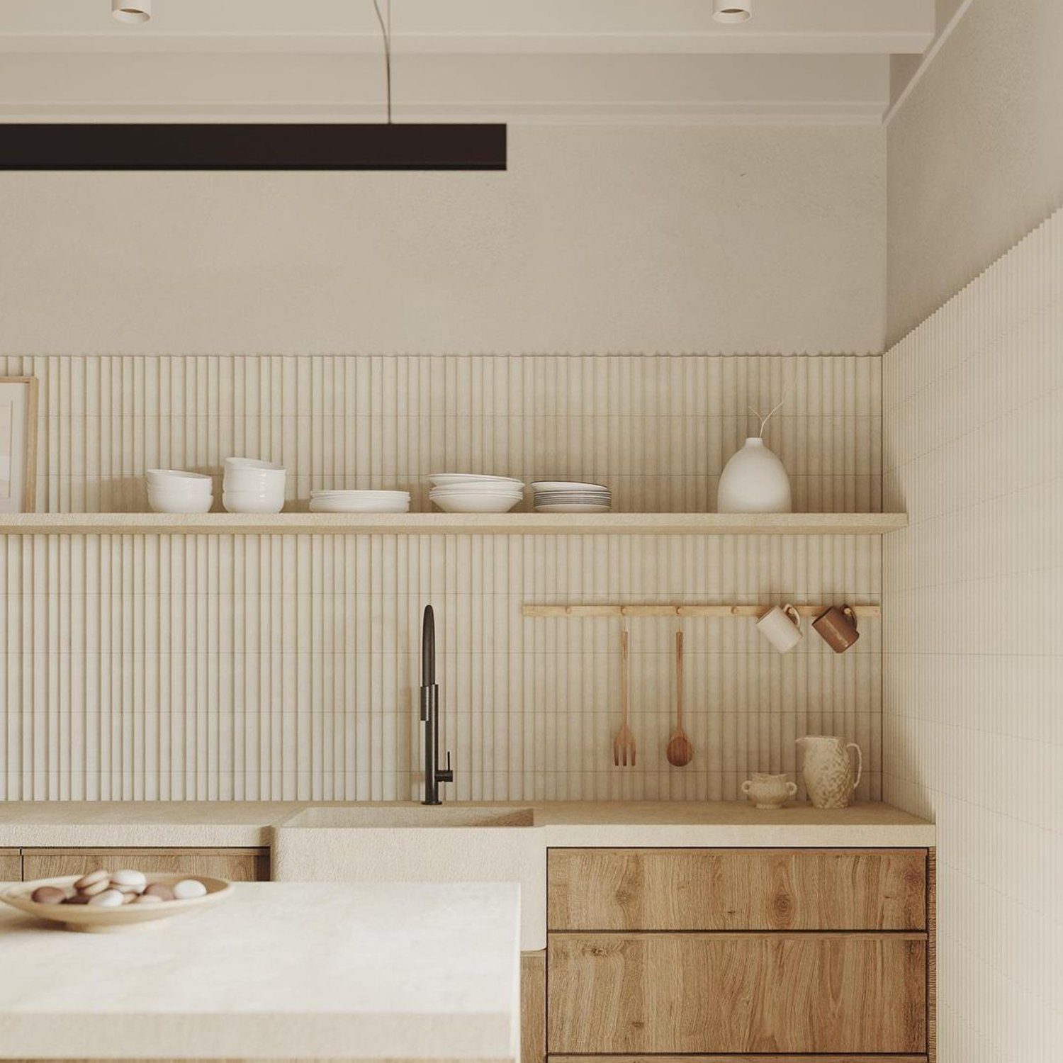 A minimally designed kitchen with wooden cabinetry and beige tiled walls