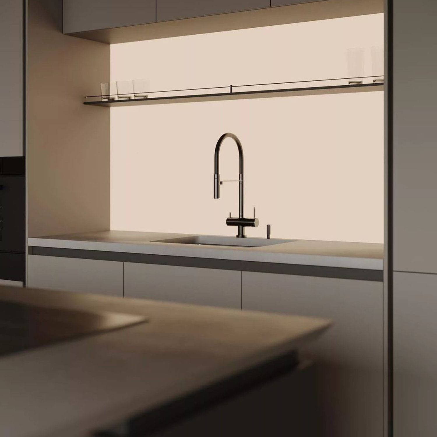 A sleek, minimalist kitchen featuring a streamlined design with monochrome tones and clean lines