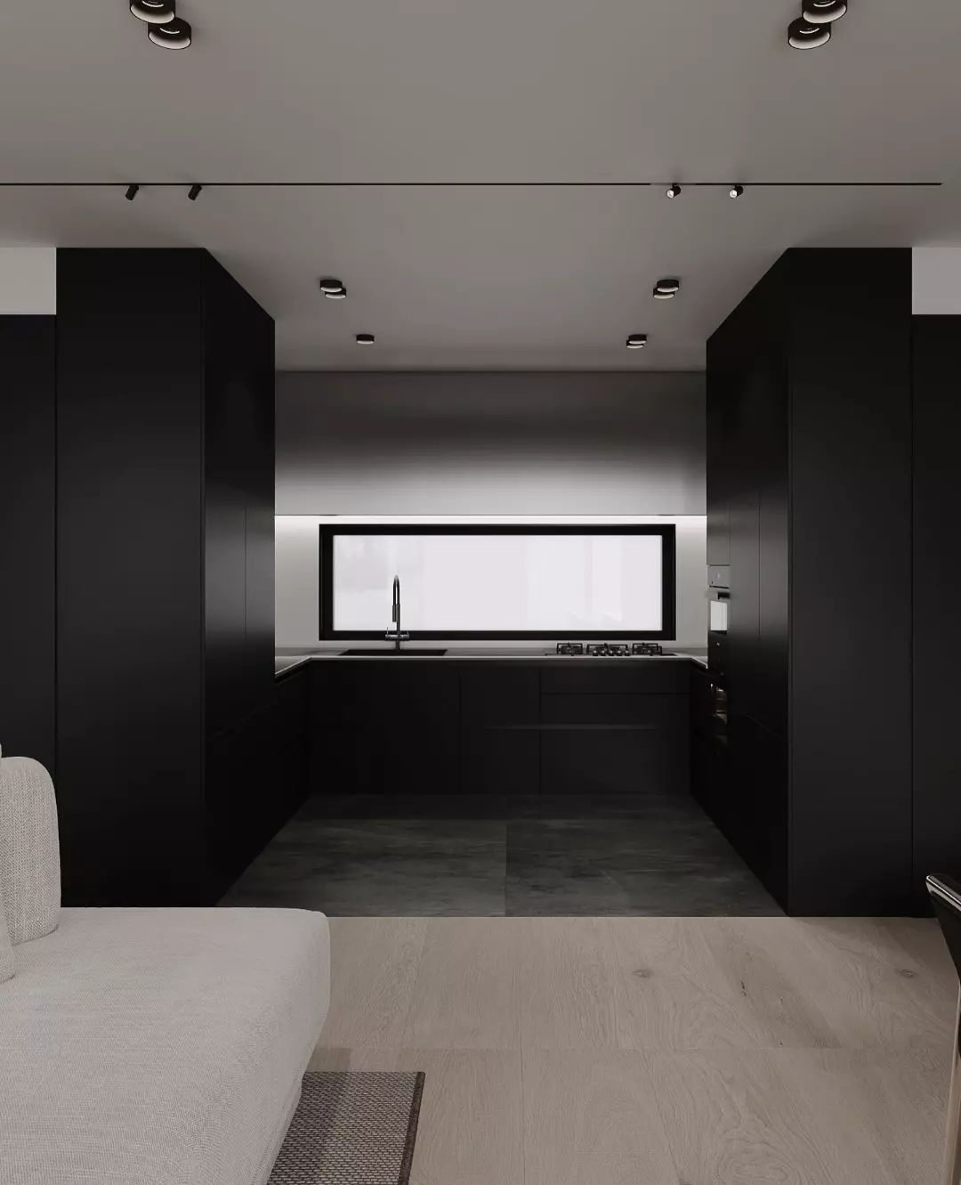 A modern kitchen boasting matte black cabinetry underlined by sleek white countertops and minimalist fixtures