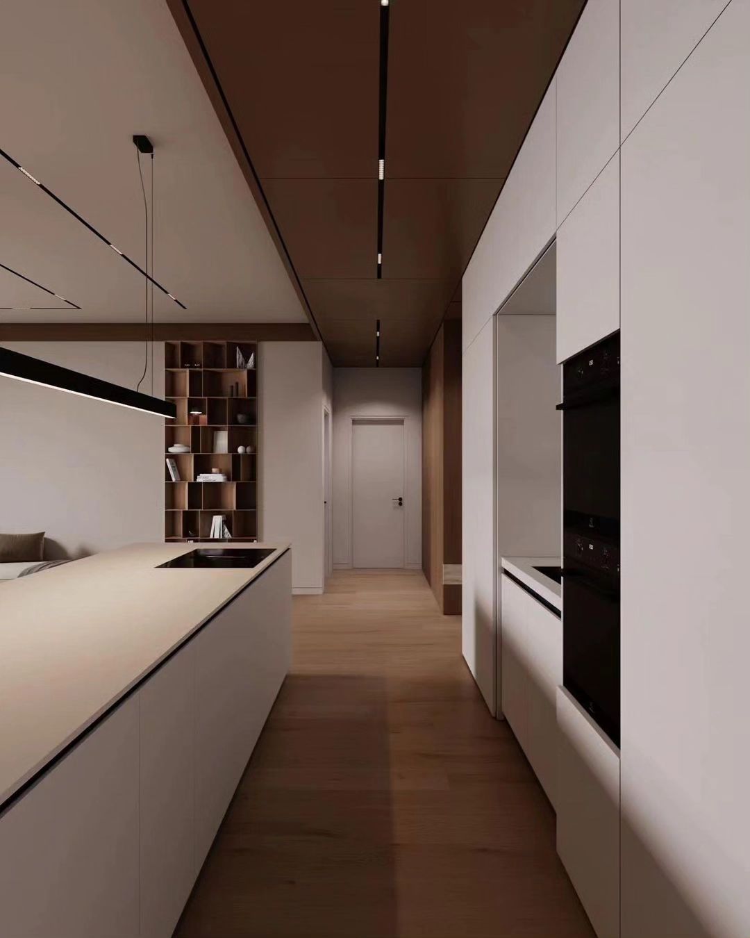 A minimalist kitchen with sleek cabinetry and subtle lighting