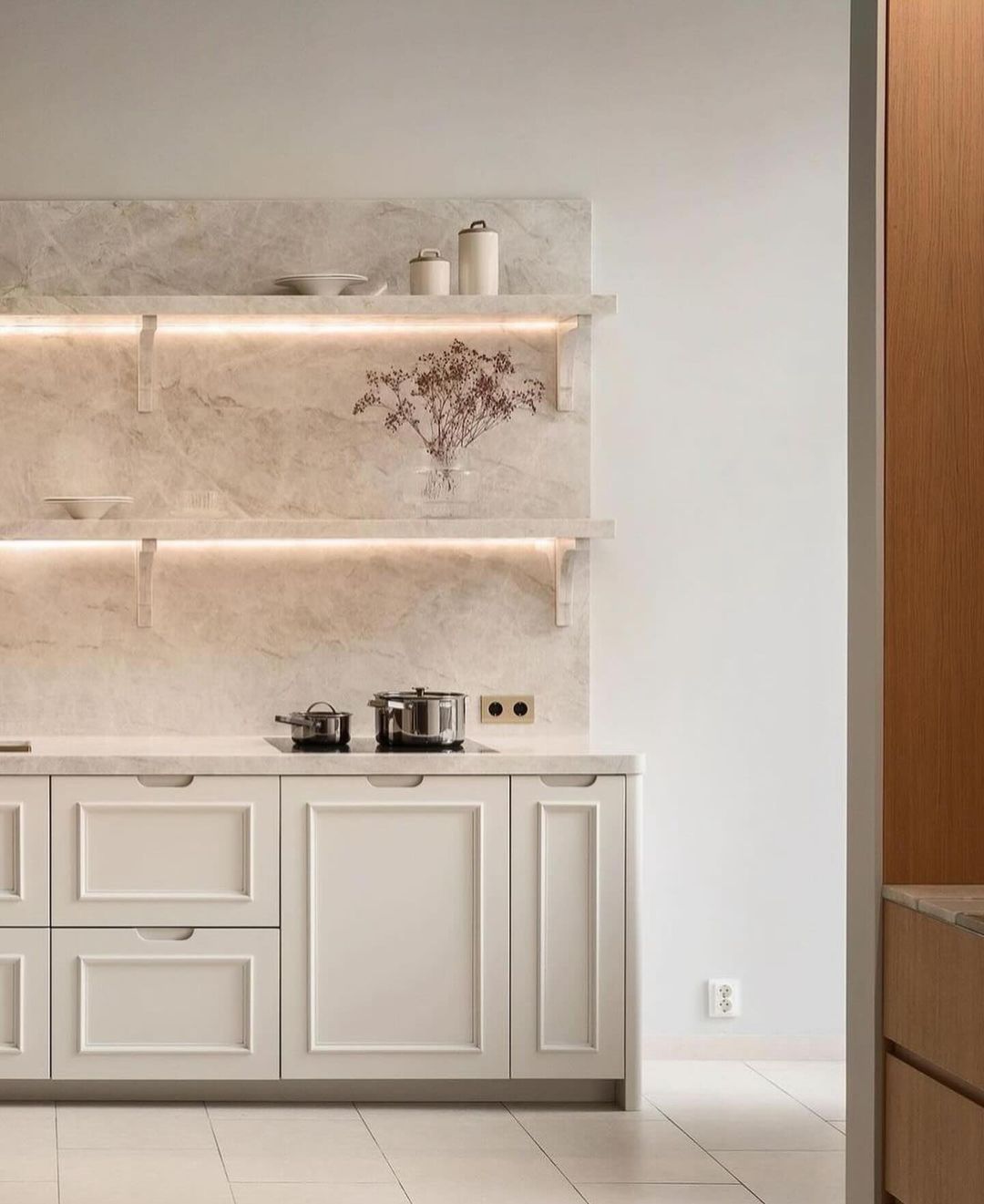 Modern minimalist kitchen with marble backsplash