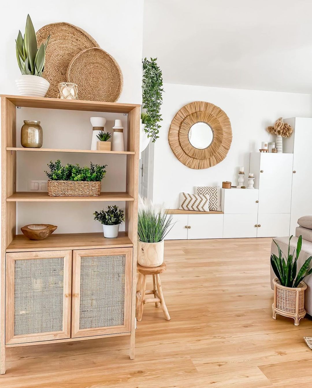 A tastefully arranged minimalist living space with natural wood and green accents.