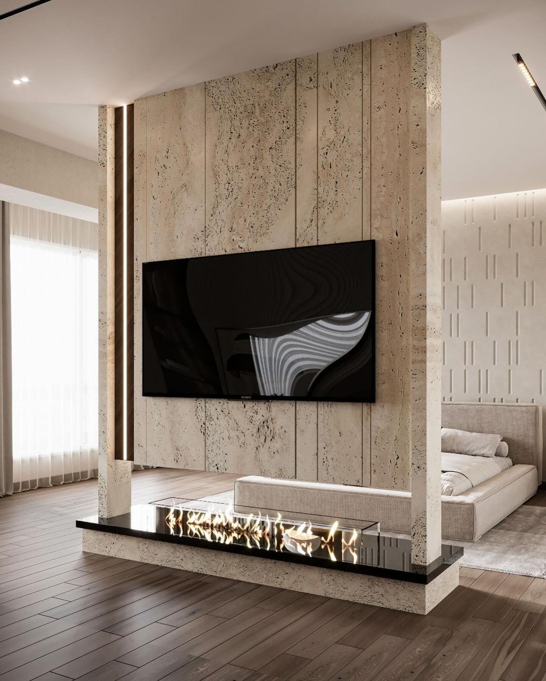 A modern minimalist living room interior featuring a travertine textured wall with integrated bioethanol fireplace and a wall-mounted TV