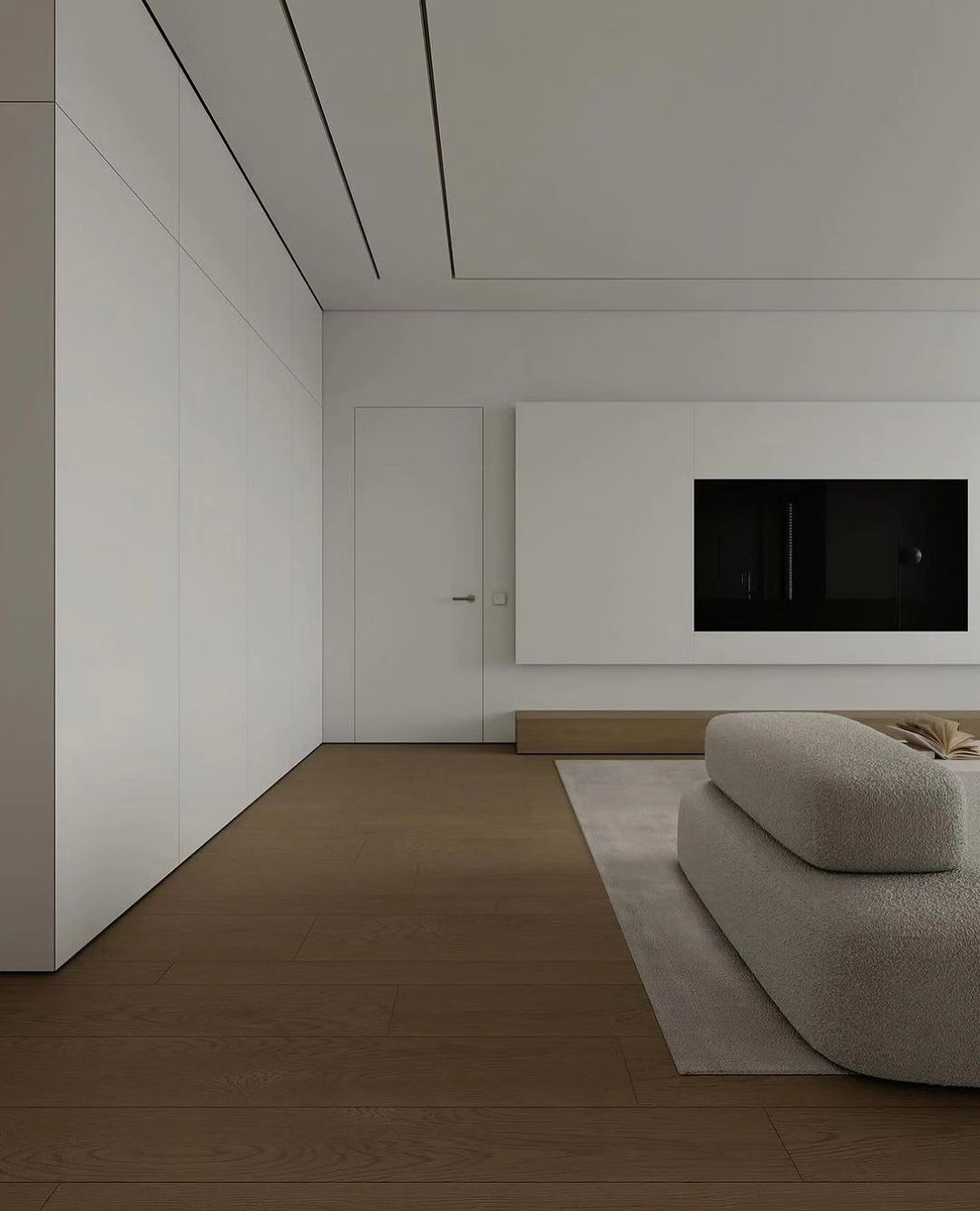 A minimalist living room with seamless white walls