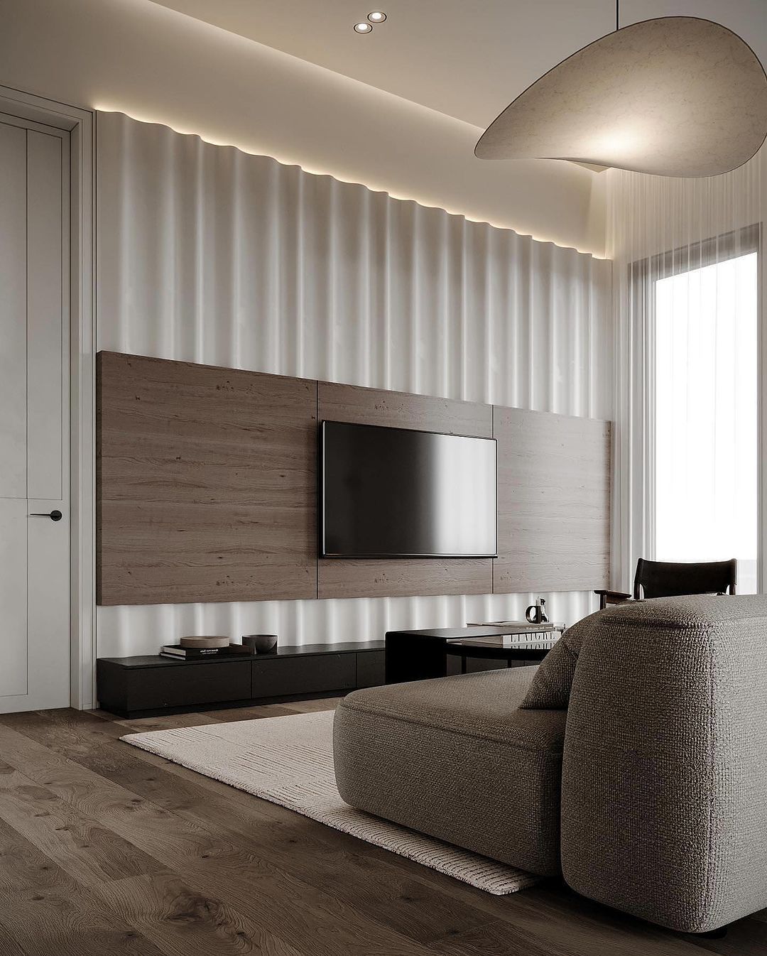 A modern living room with minimalist design featuring a textured fabric sofa, a sleek wooden media unit, and a unique wavy ceiling accent illuminated with soft LED lighting.