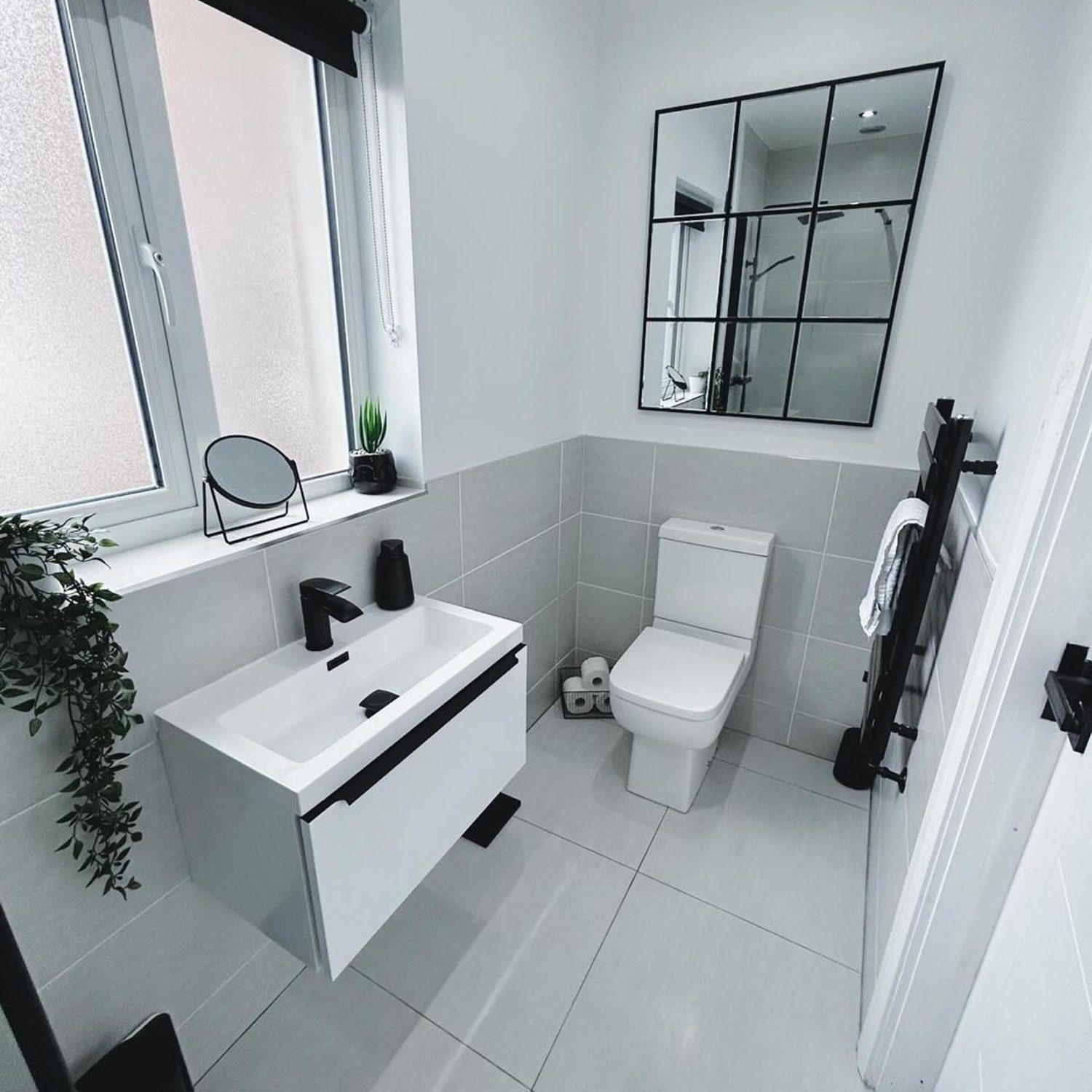 A modern, monochrome bathroom showcasing sleek design