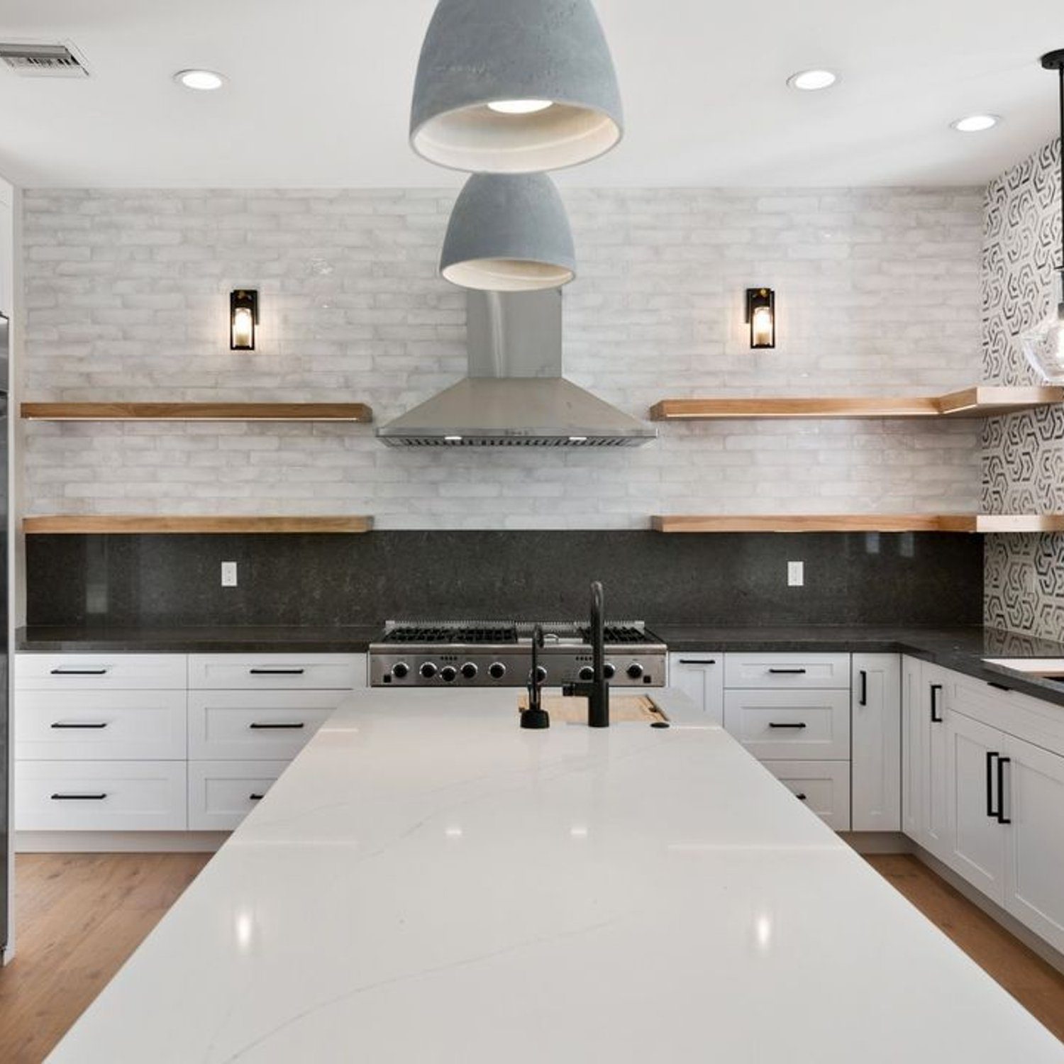 A sleek modern kitchen with clean lines and a monochrome color palette