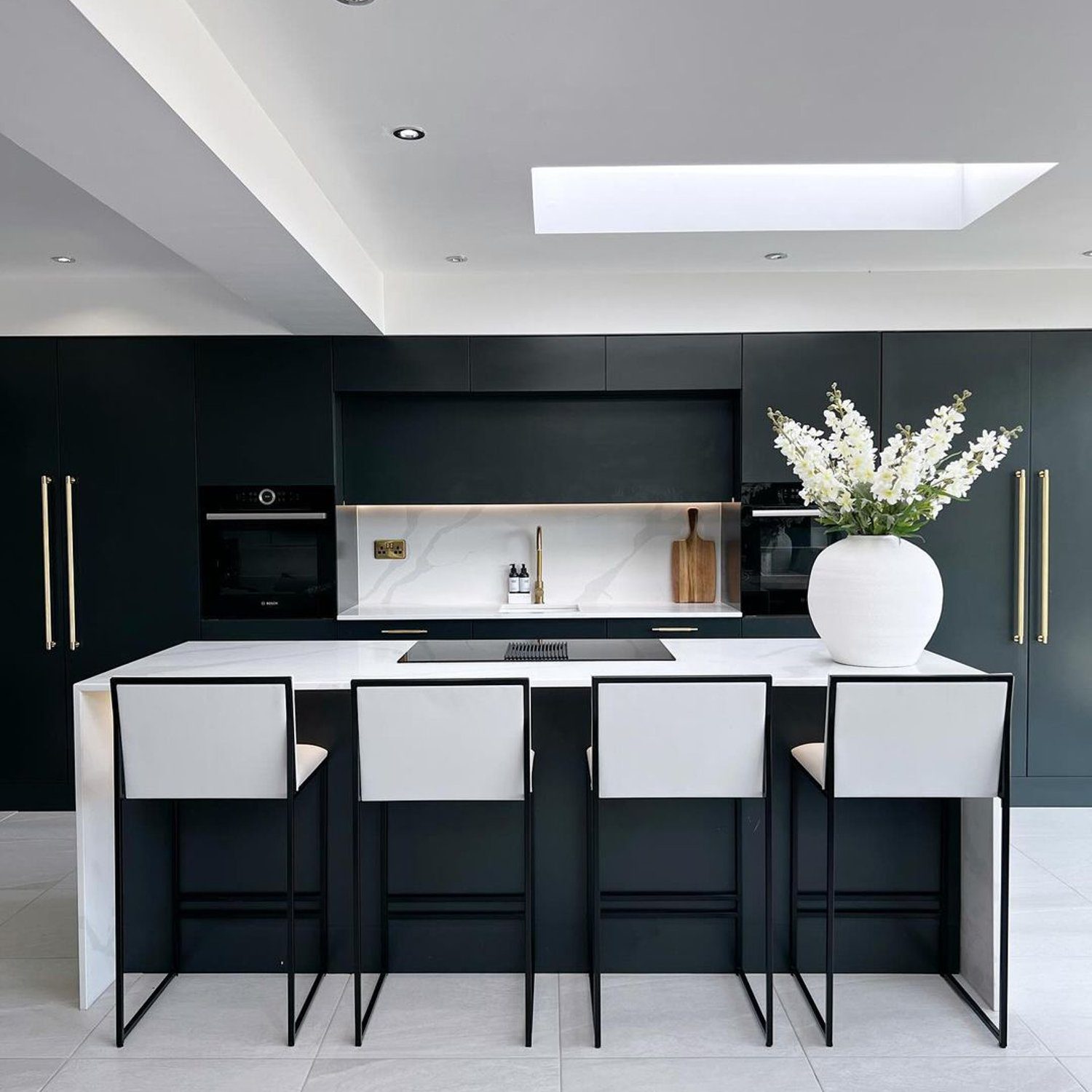 An elegantly designed modern kitchen with monochrome tones