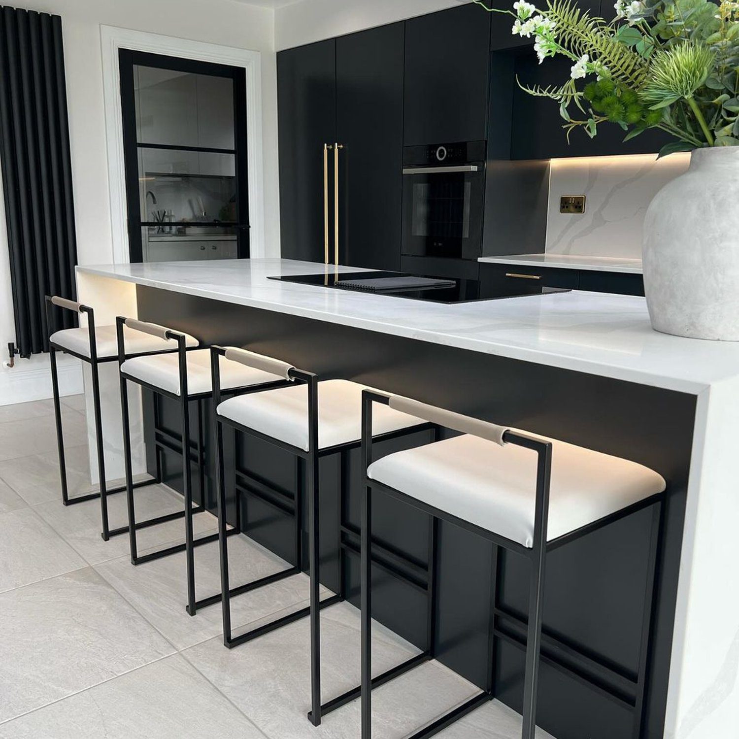 An elegantly designed modern kitchen with a monochrome theme