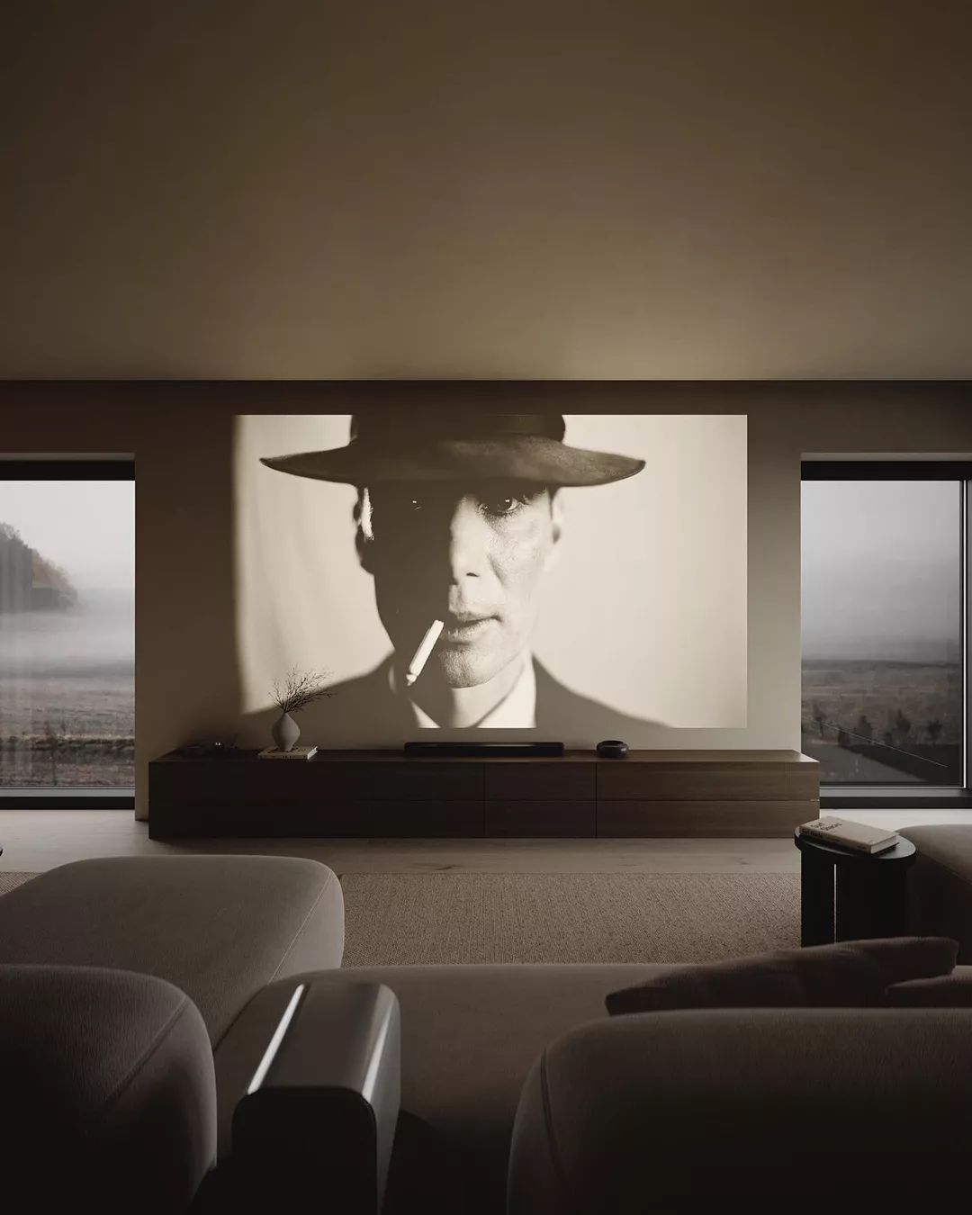 A modern living room with a monochrome portrait projection on the wall