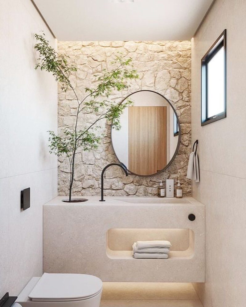 A minimalist bathroom featuring natural textures and modern fixtures