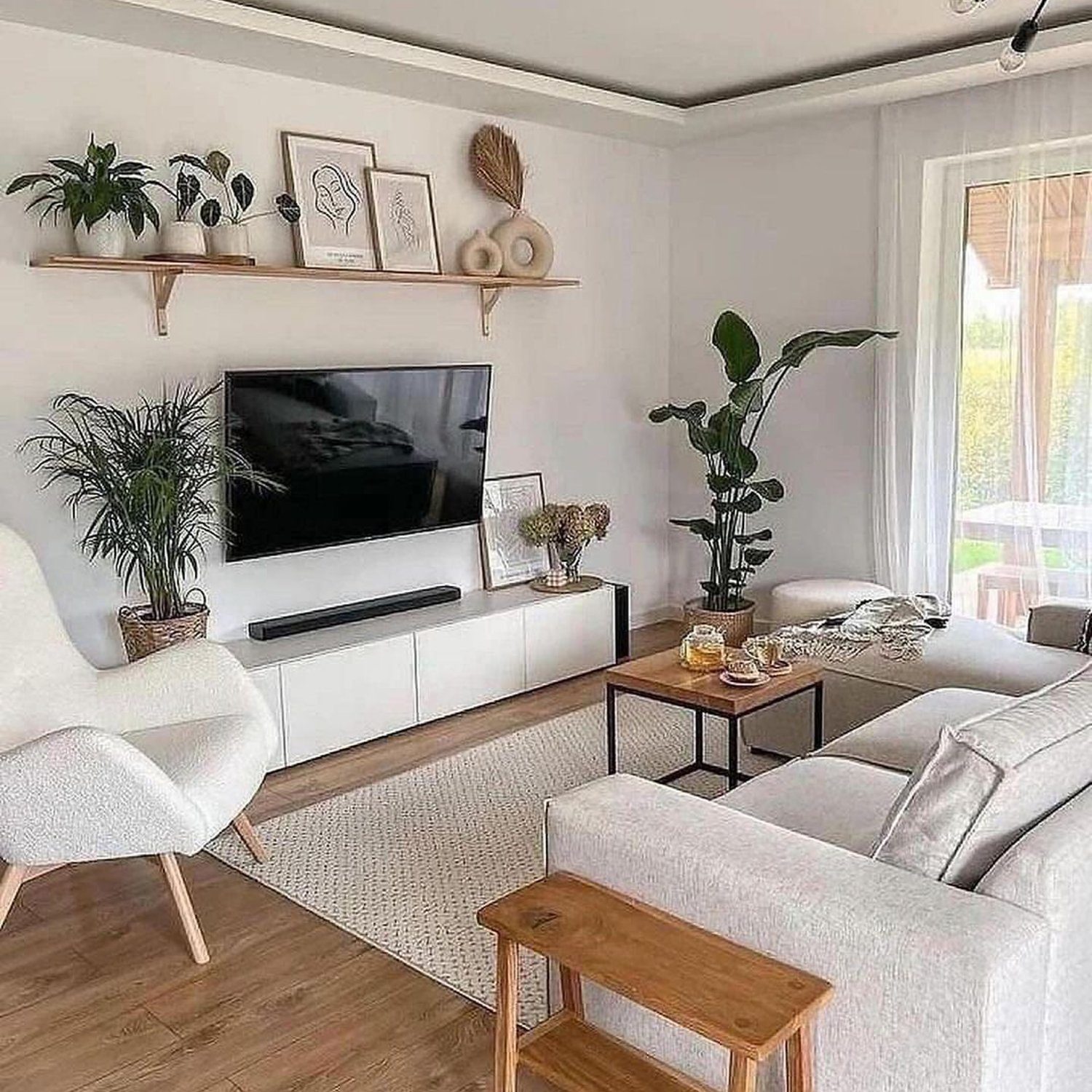 A cozy, well-organized living room with modern neutral tones