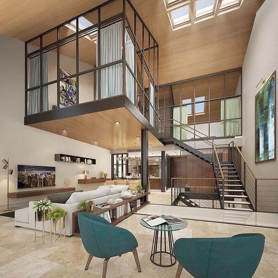 A modern open-plan living area with high ceilings and large windows