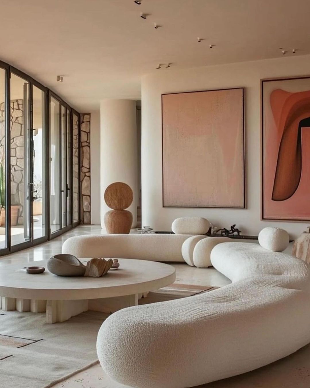 A serene modern living room with organic forms and a neutral palette