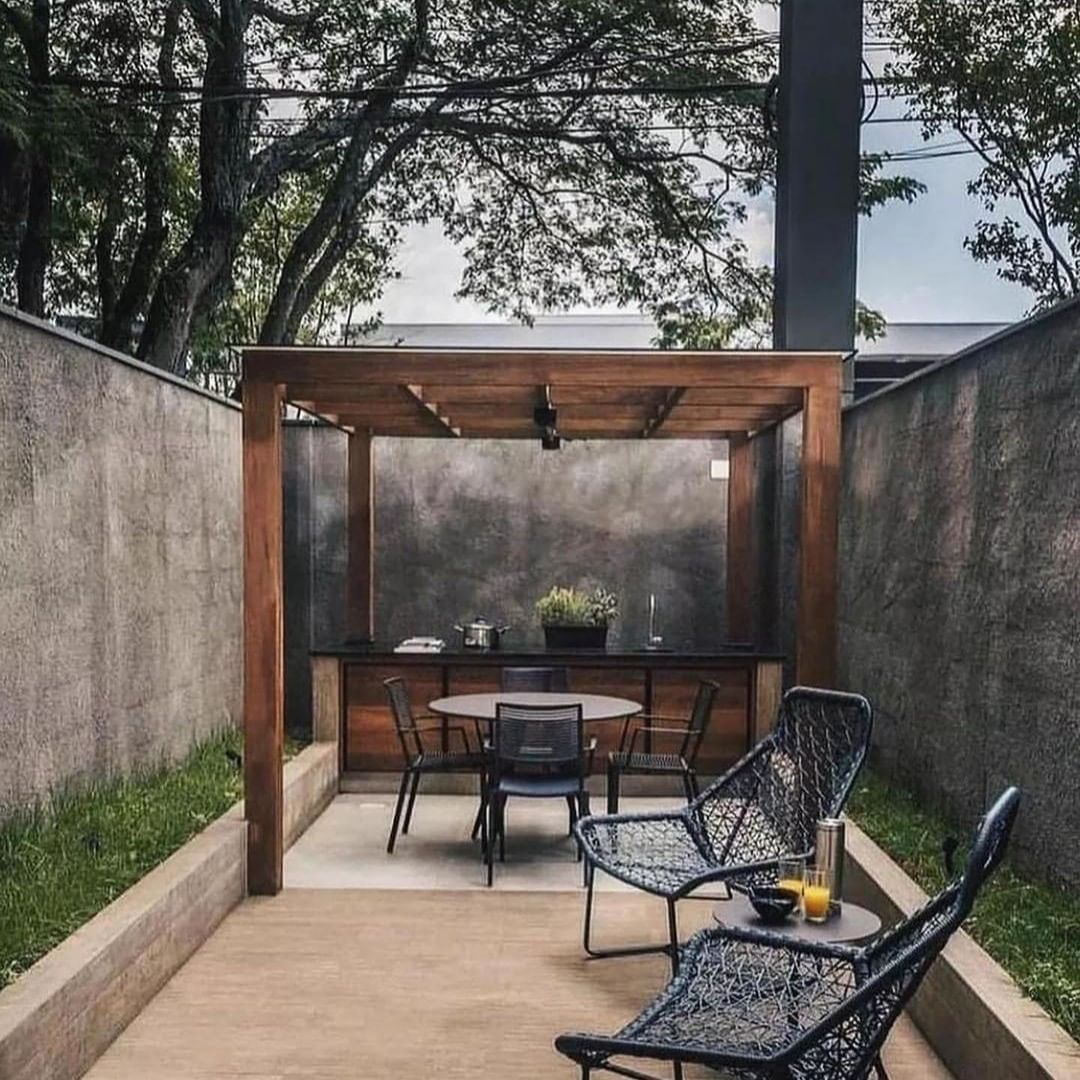 Stylish Outdoor Workspace with Overhead Wooden Pergola