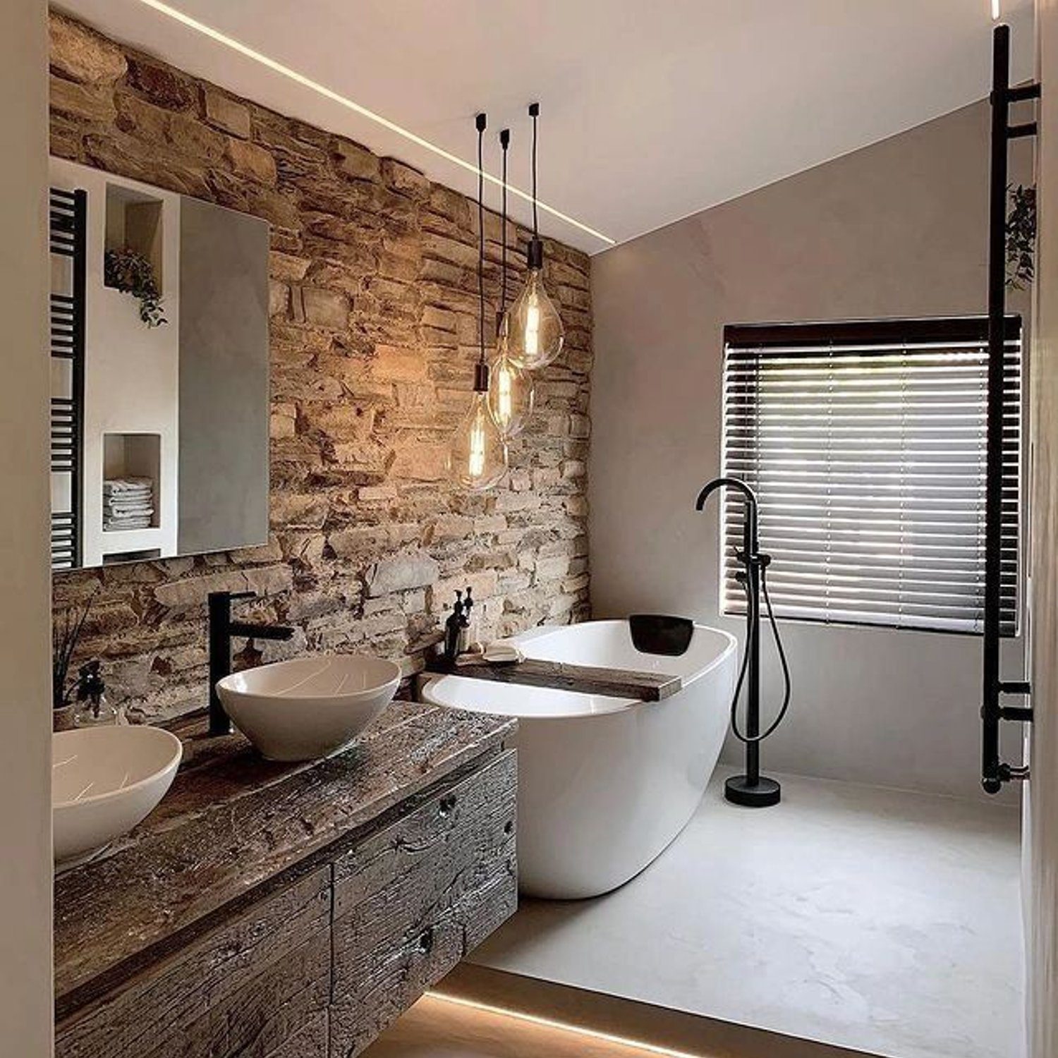 A sophisticated bathroom featuring rustic stone walls