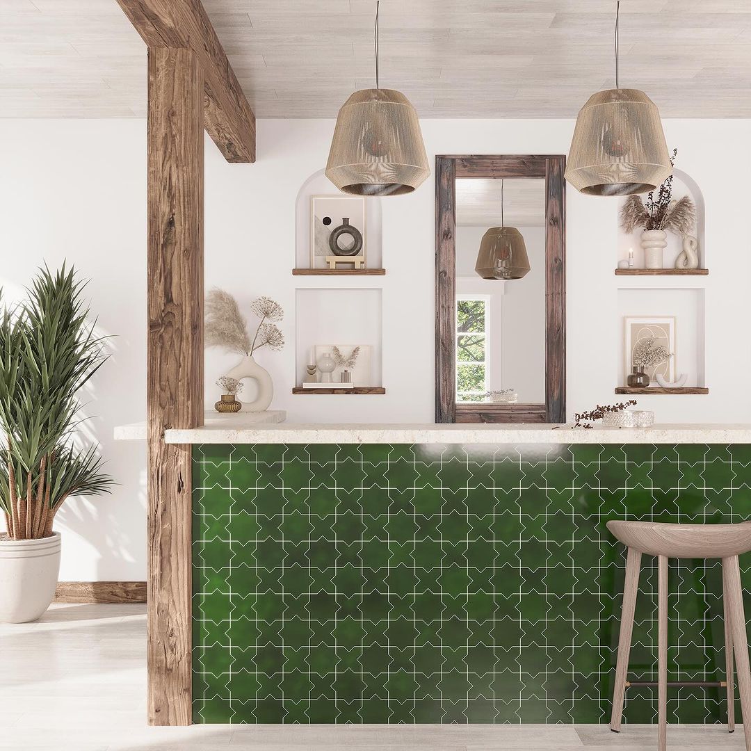 A modern kitchen design featuring rustic wooden beams, green patterned tiles, and stylish pendant lights.