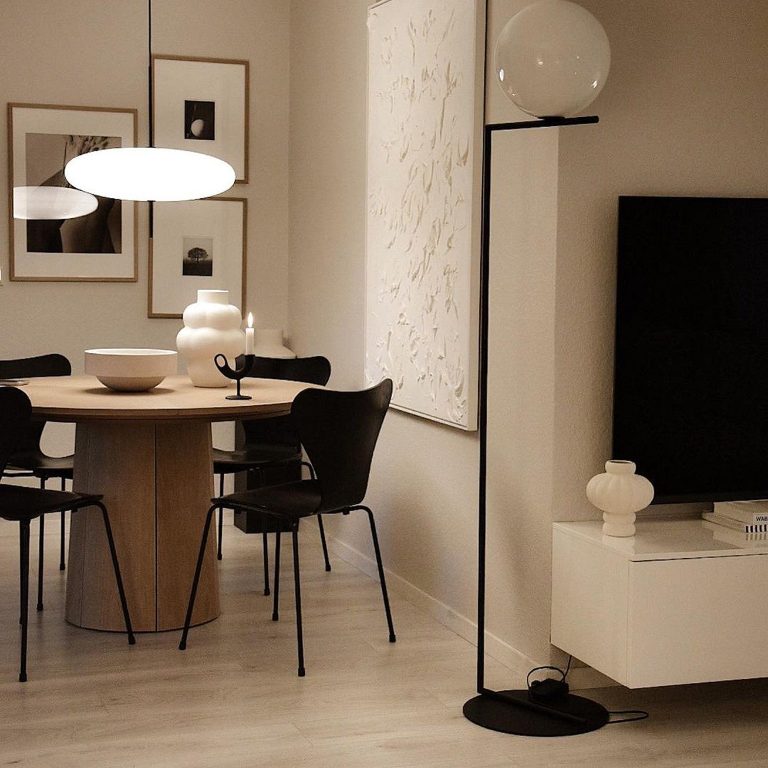 A modern and minimalistic dining room with a Scandinavian aesthetic