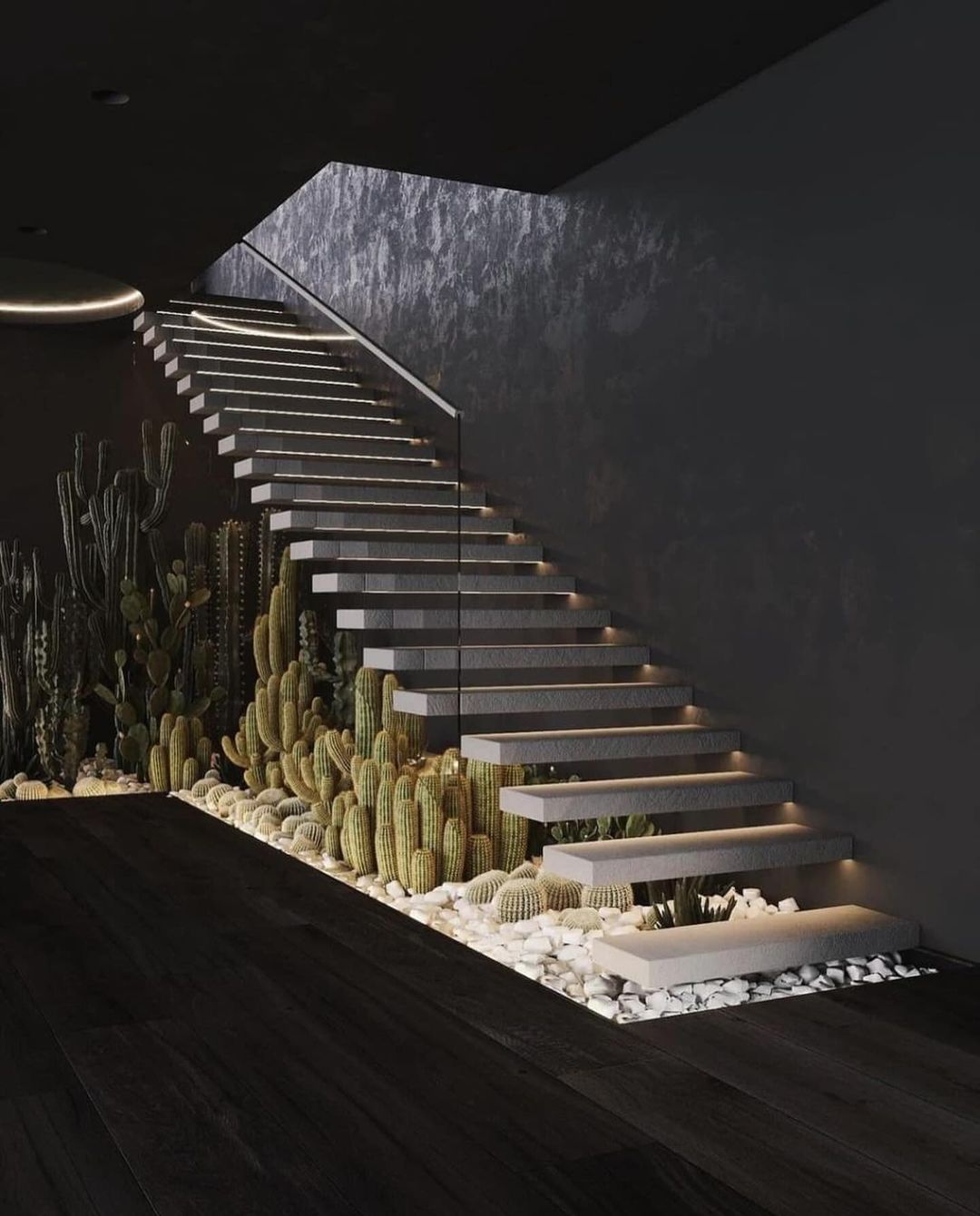 A chic staircase design incorporating cacti and pebble details