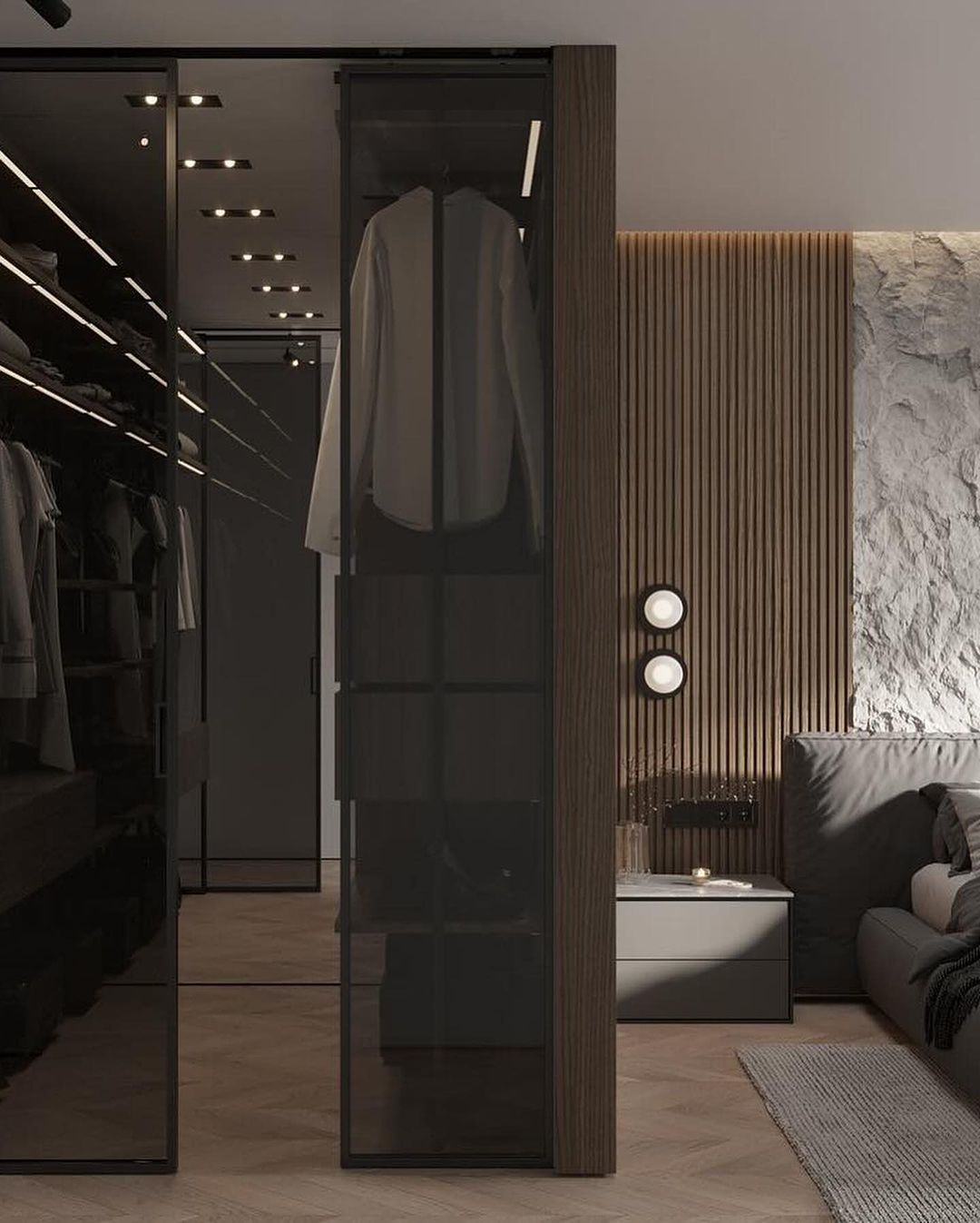 A well-organized walk-in closet featuring sleek dark-toned shelves and a striking glass wardrobe contrasted with warm wooden textures