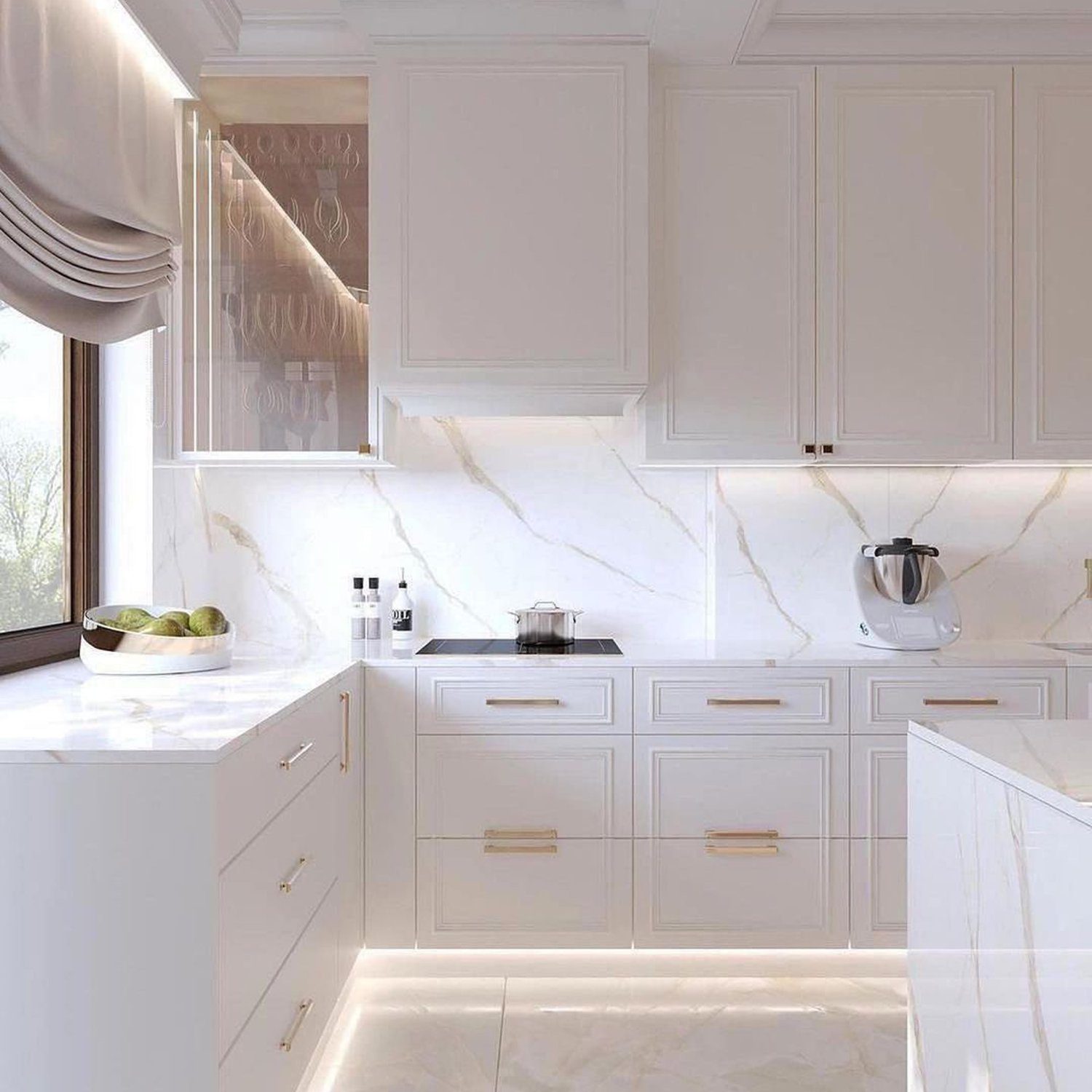 Elegant and modern white kitchen with marble accents