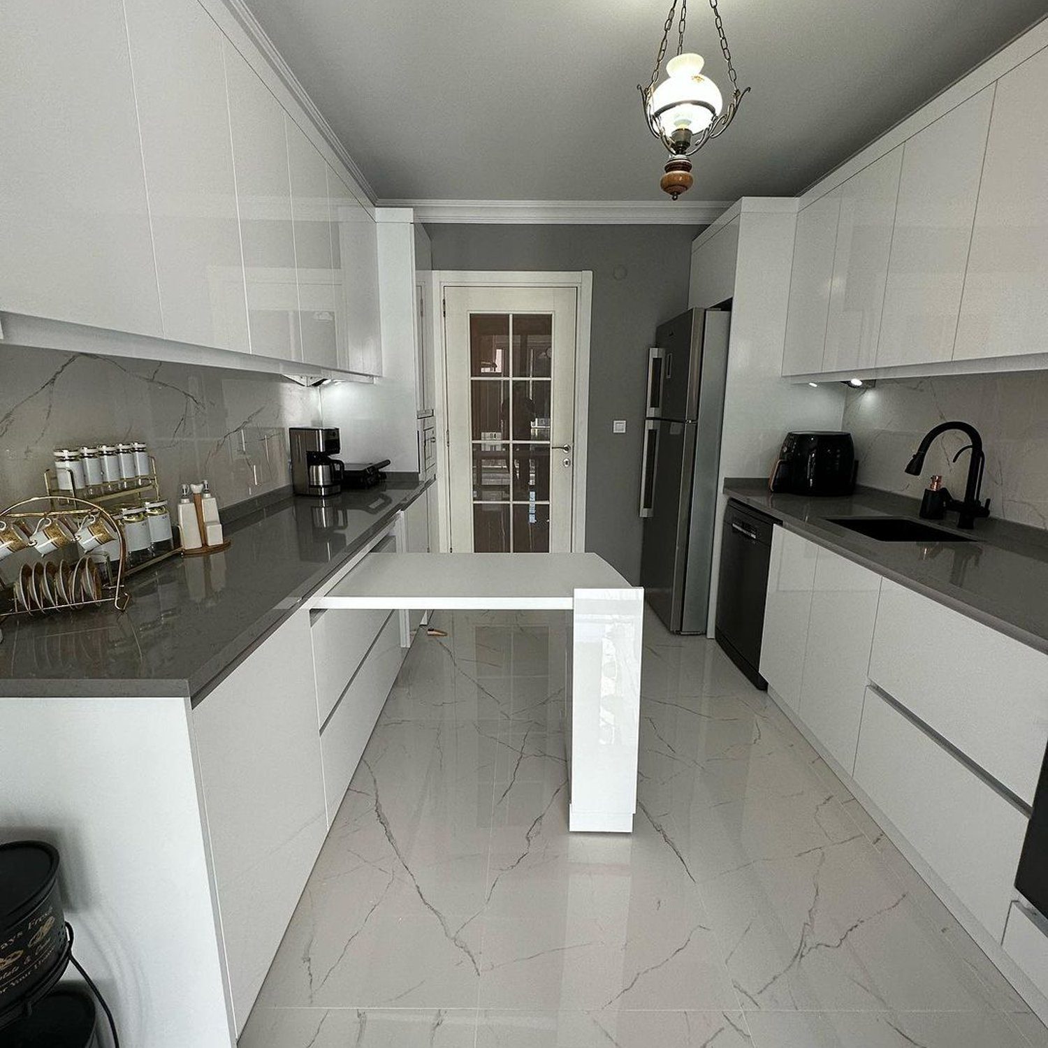 Elegant modern kitchen with white cabinetry