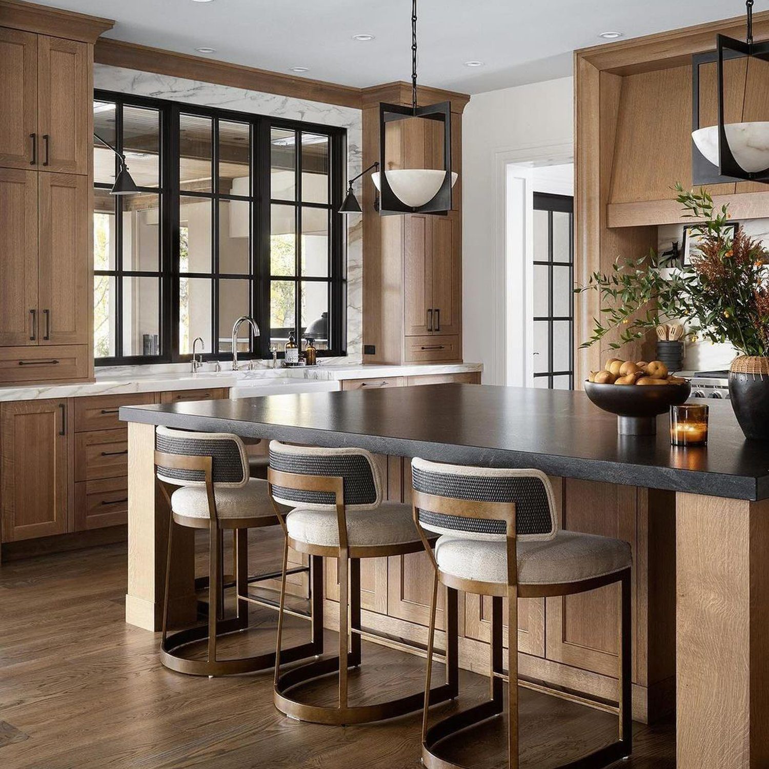 Elegant modern kitchen with wooden cabinetry and a central island