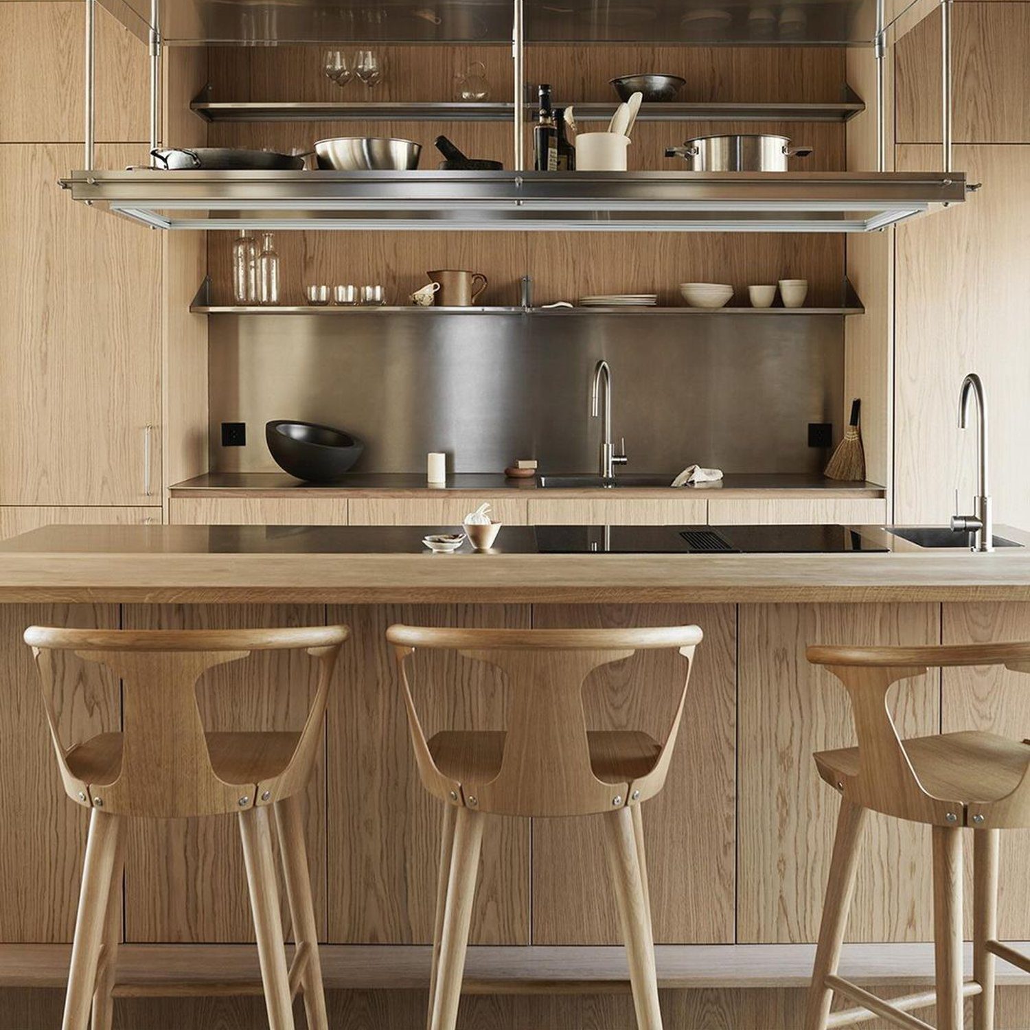 Elegant wooden kitchen design with modern bar stools