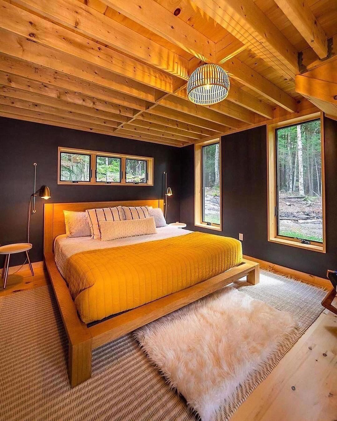 A modern and tranquil bedroom nestled in the woods