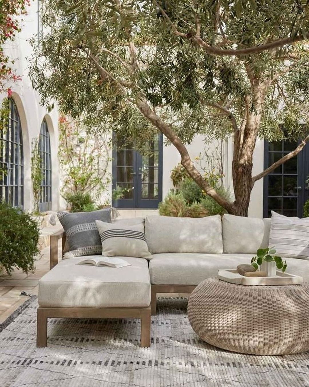 An inviting outdoor oasis featuring a comfy corner sofa