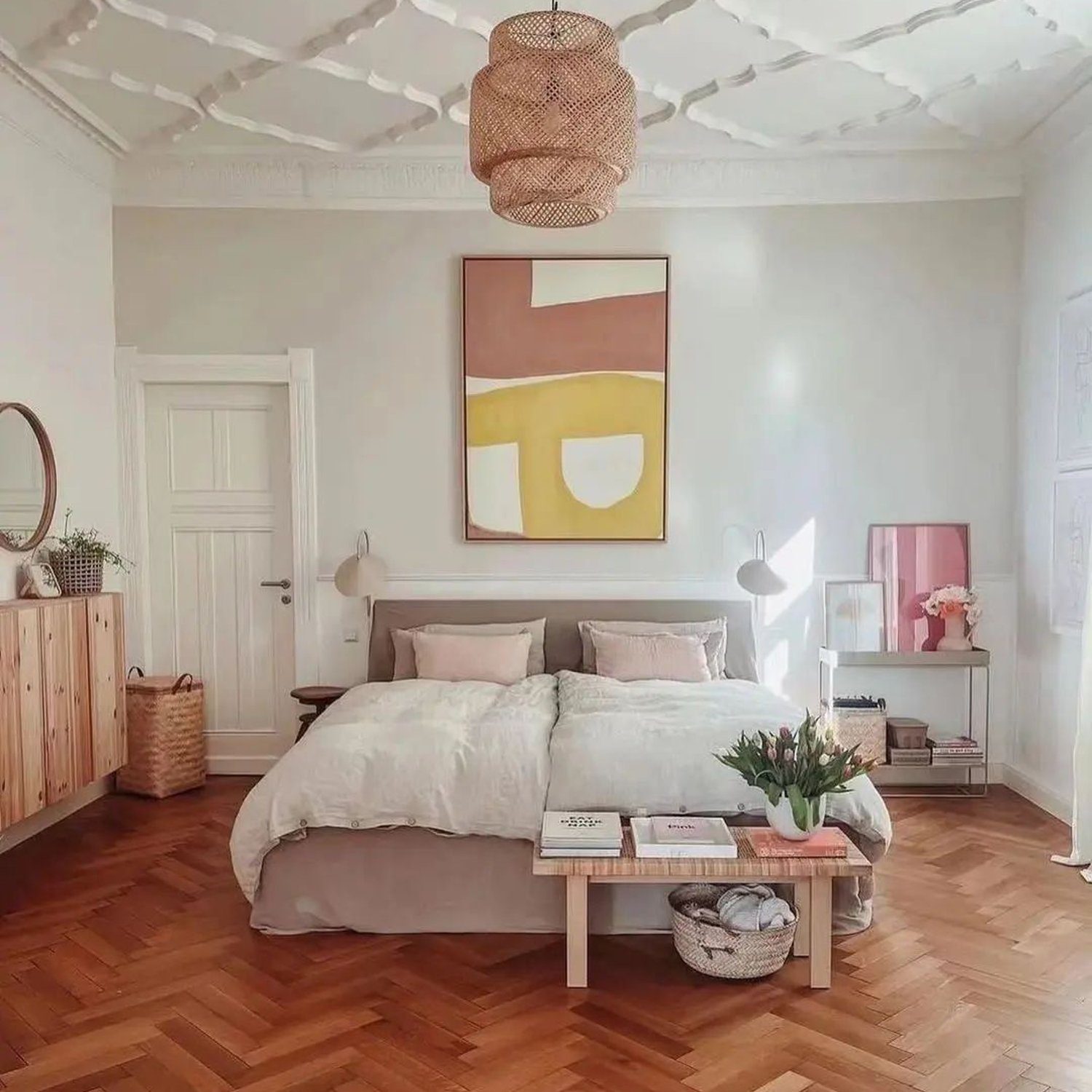 Elegantly designed bedroom with artistic ceiling and warm wood tones