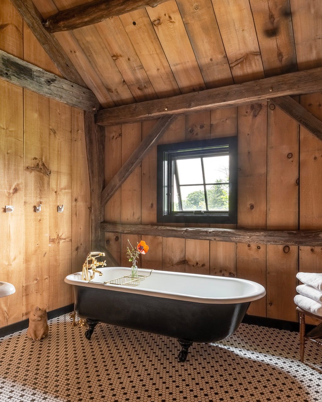 Cozy rustic bathroom with a claw-foot bathtub