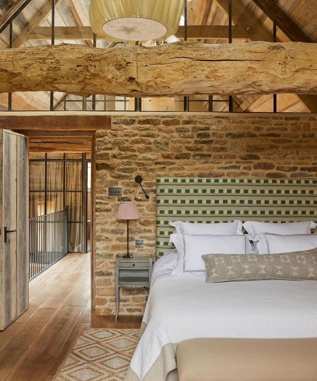 Rustic Bedroom with Stone Accent Wall