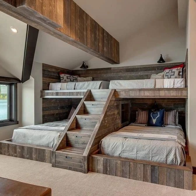 A functional and rustic bunk bed setup with a stair-step design