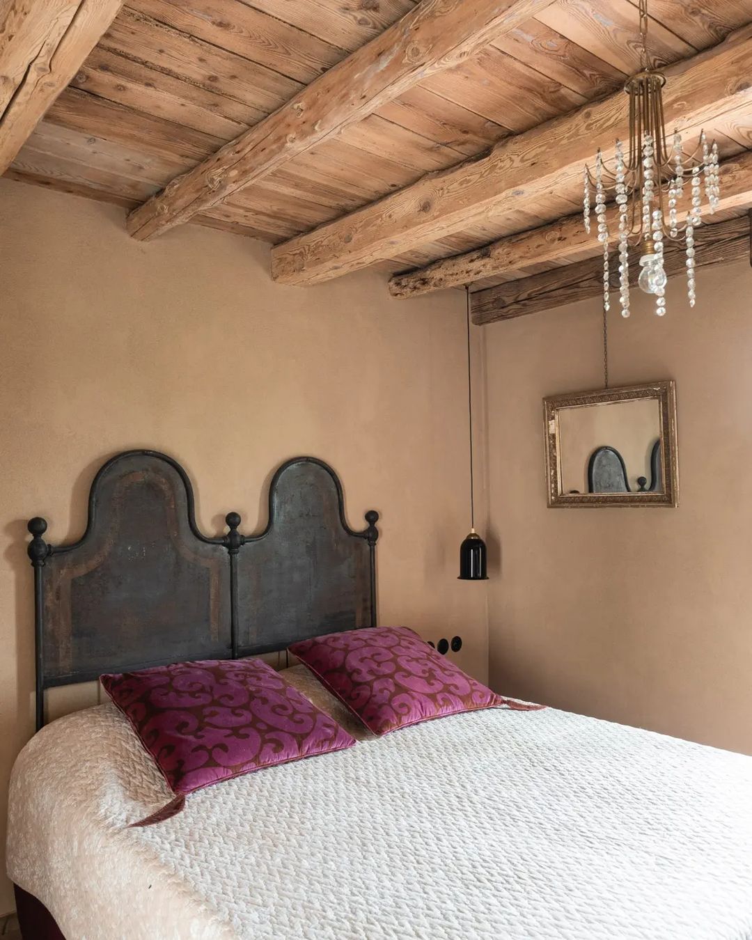 Rustic bedroom with exposed wooden beams