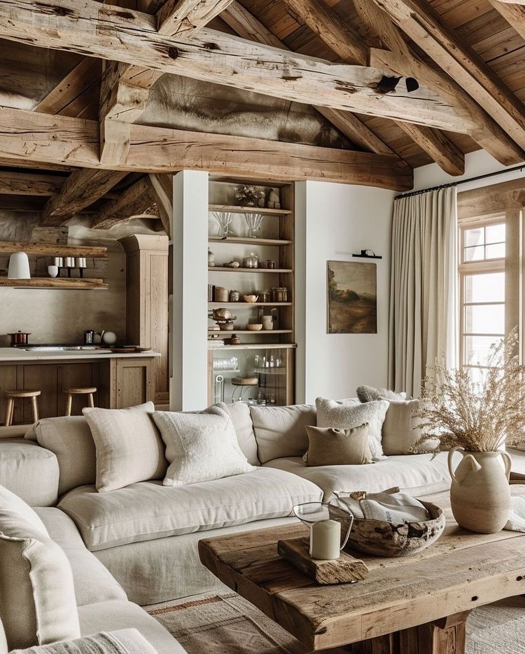 Cozy living room with exposed wooden beams and neutral tones