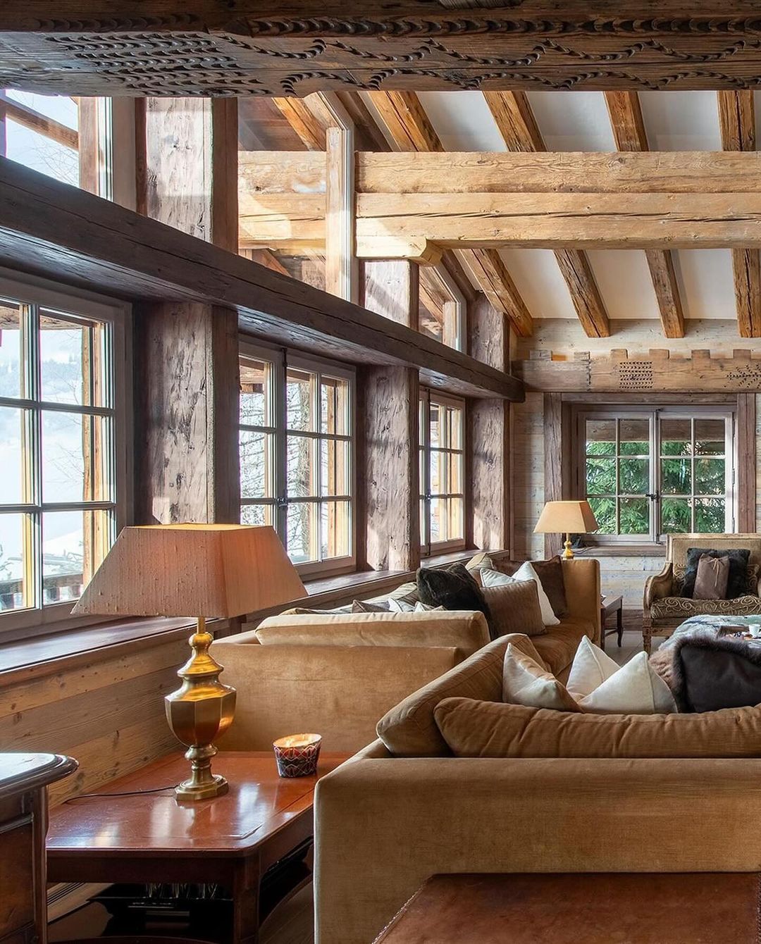 Cozy mountain retreat living room with natural wood elements and large windows