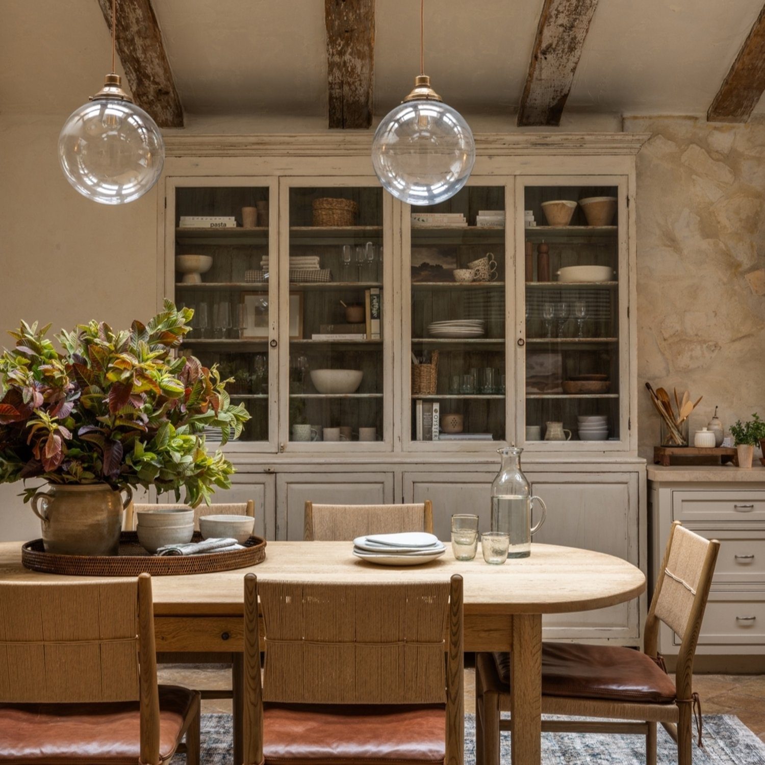 Cozy rustic kitchen with exposed wooden beams and a vintage cabinet