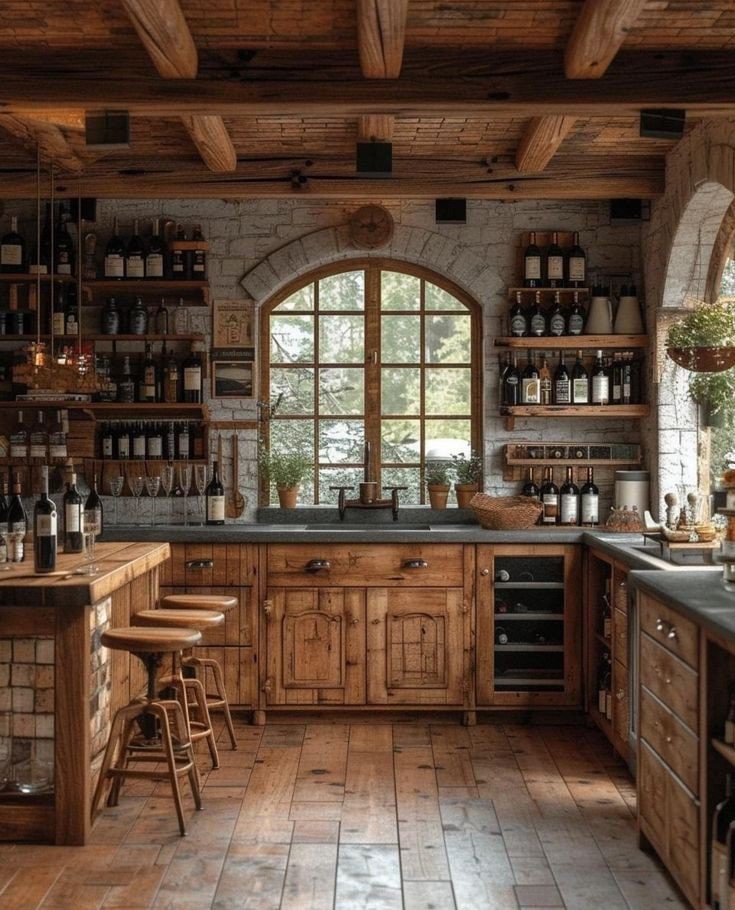 A rustic kitchen design featuring wooden cabinetry, exposed beams, and a beautiful stone arch window.