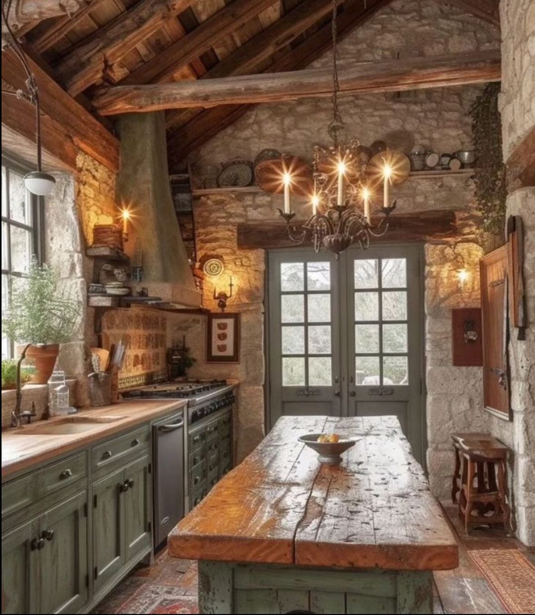 A rustic kitchen with a warm ambiance featuring exposed wooden beams and stone walls.