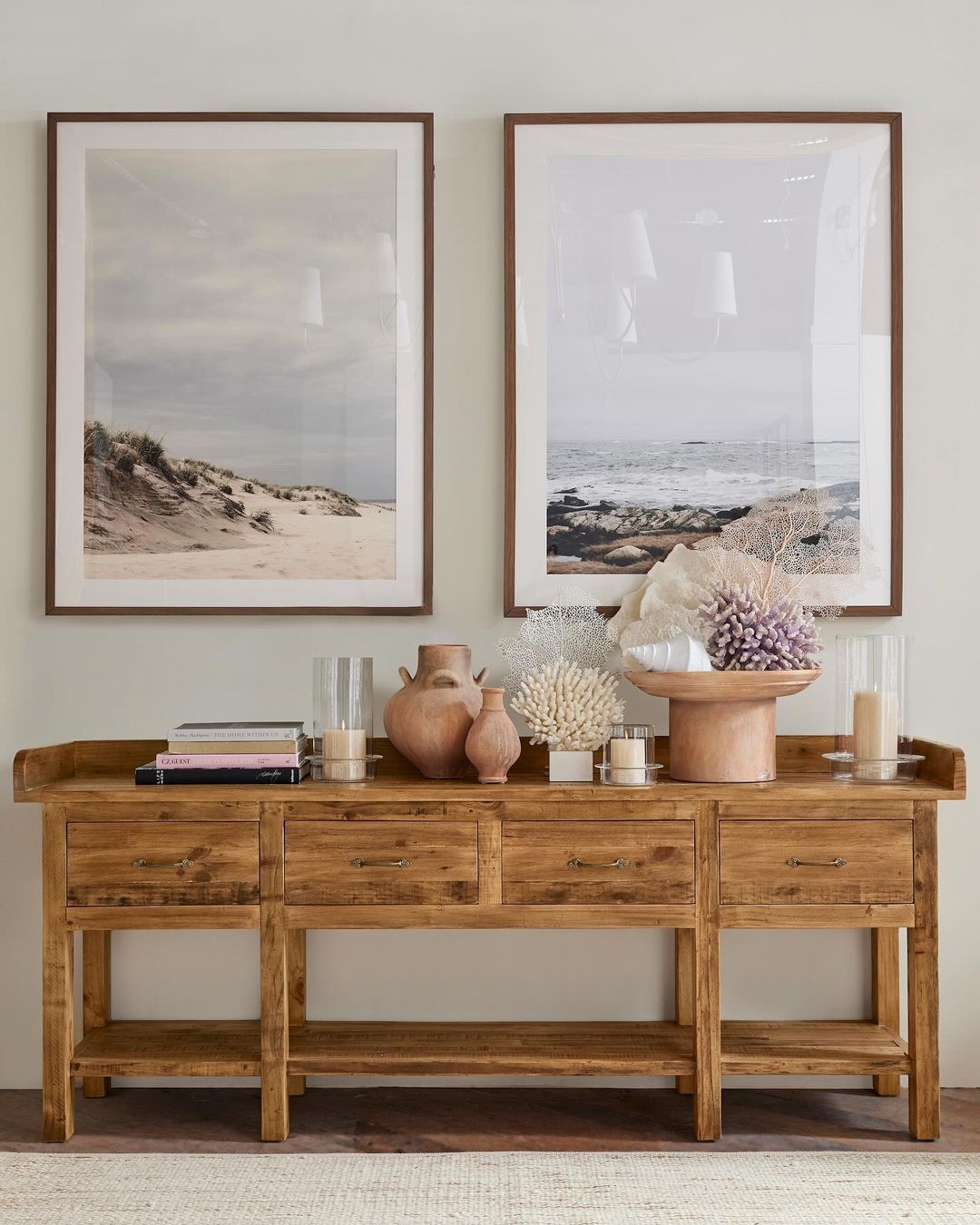 A tastefully decorated hallway featuring a wooden console table with a rustic charm