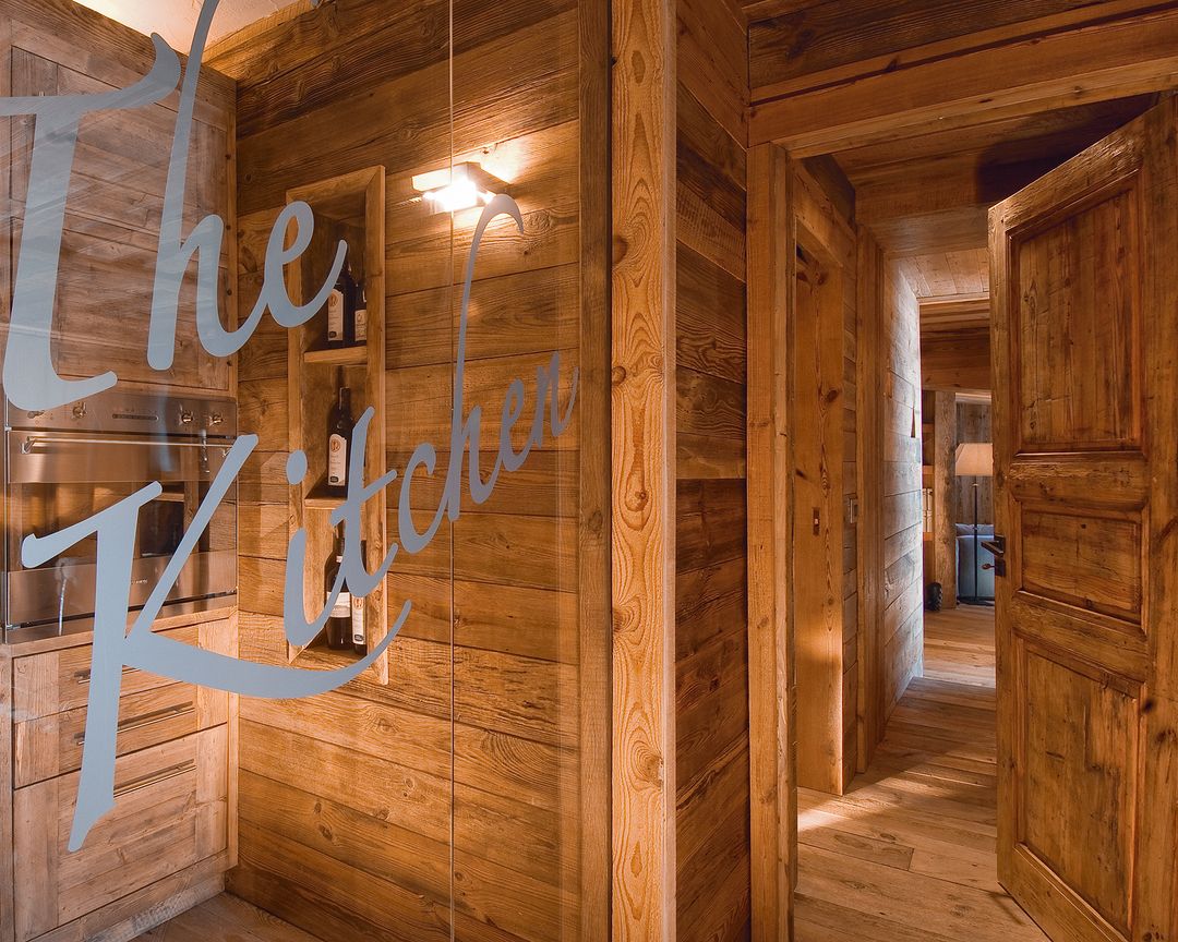 Rustic wooden kitchen interior with glass door